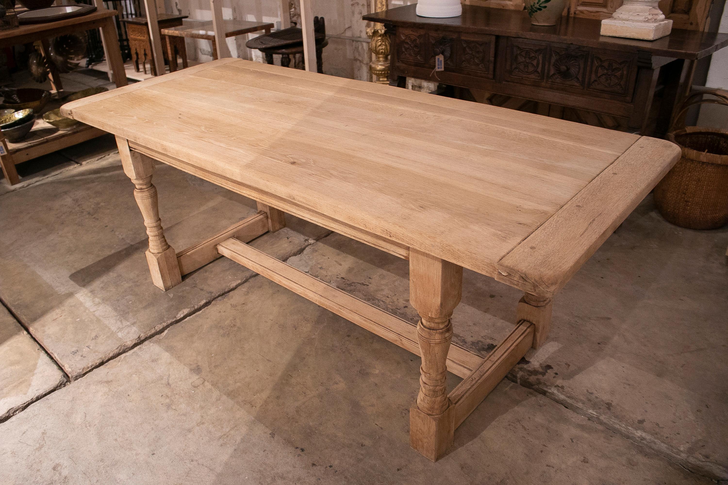 Rustic 1930s Spanish washed wood dining table with crossbeam.