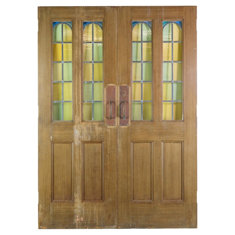 Portes doubles en acier des années 1930 avec panneaux de verre au plomb  arqué En vente sur 1stDibs