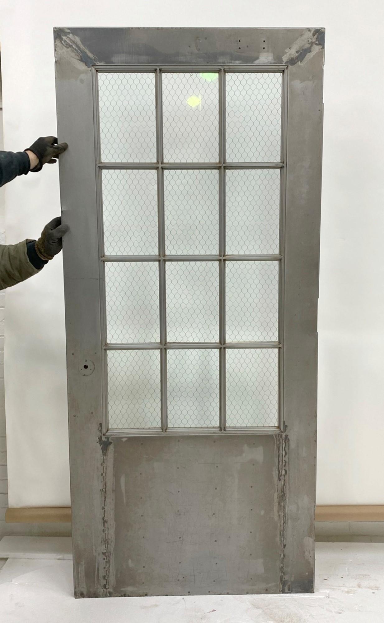 1930s Steel Fire Door with Chicken Wire Glass 12 Lites by Art Metal Co. In Good Condition In New York, NY