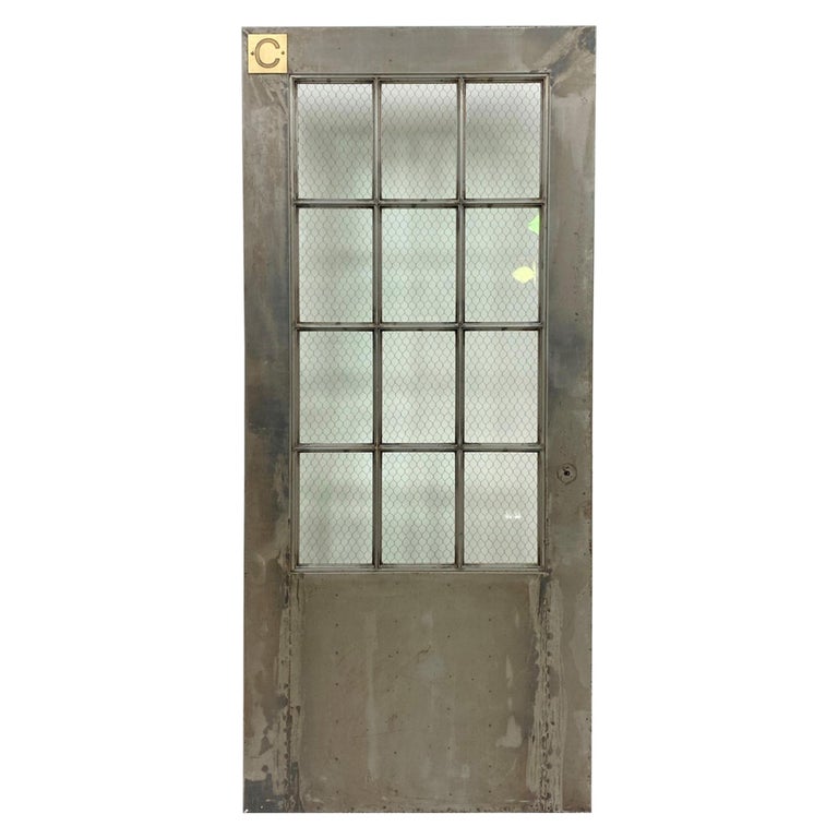 https://a.1stdibscdn.com/1930s-steel-fire-door-with-chicken-wire-glass-12-lites-by-art-metal-co-for-sale/1121189/f_223798921612598349936/22379892_master.jpg?width=768