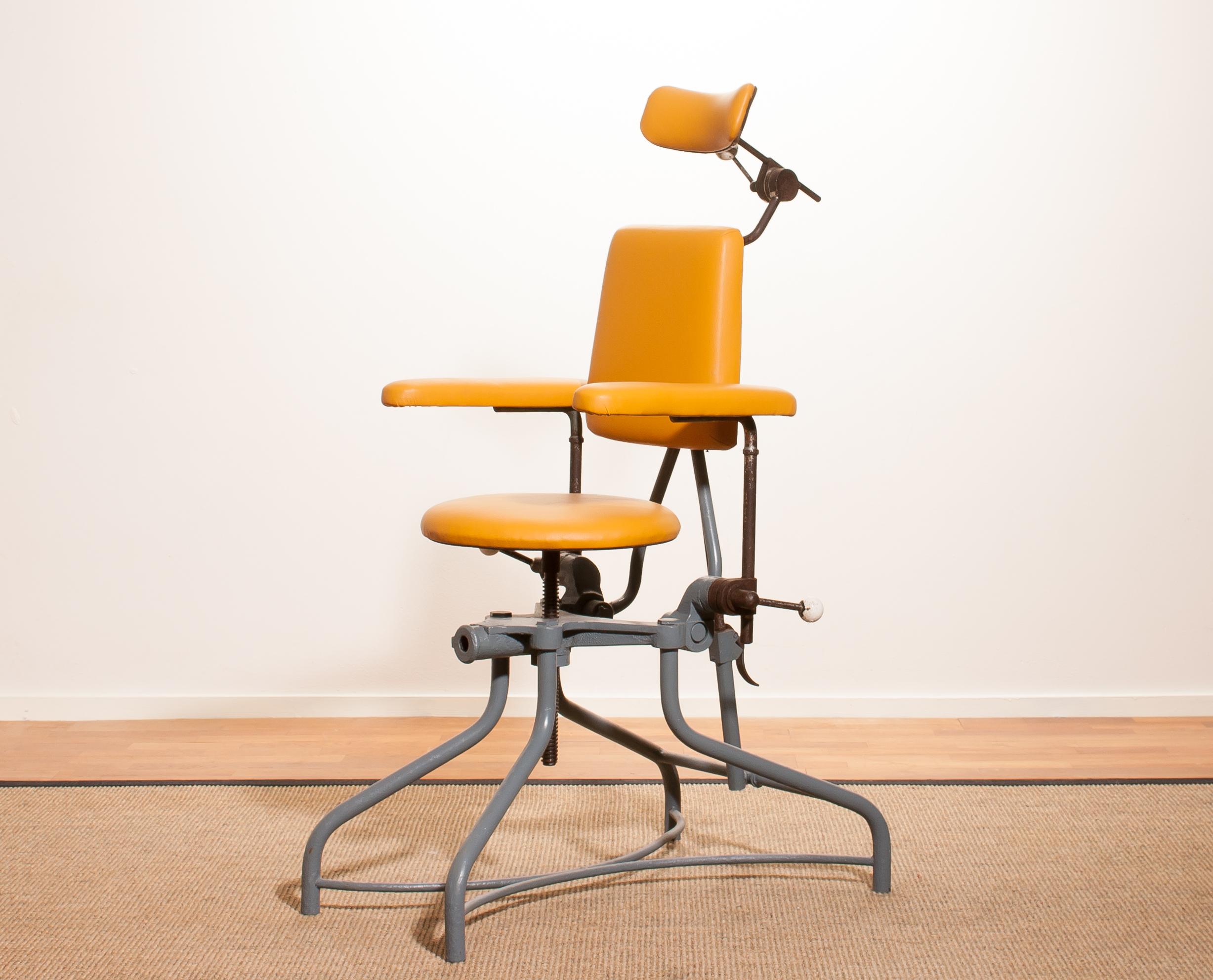 Very nice medical or dentist chair.
The frame is made of grey-blue lacquered steel with a new yellow leatherette seating and neck rest.
The seating and neck rest are adjustable in height.
Some steel parts are rusty what is normal for its