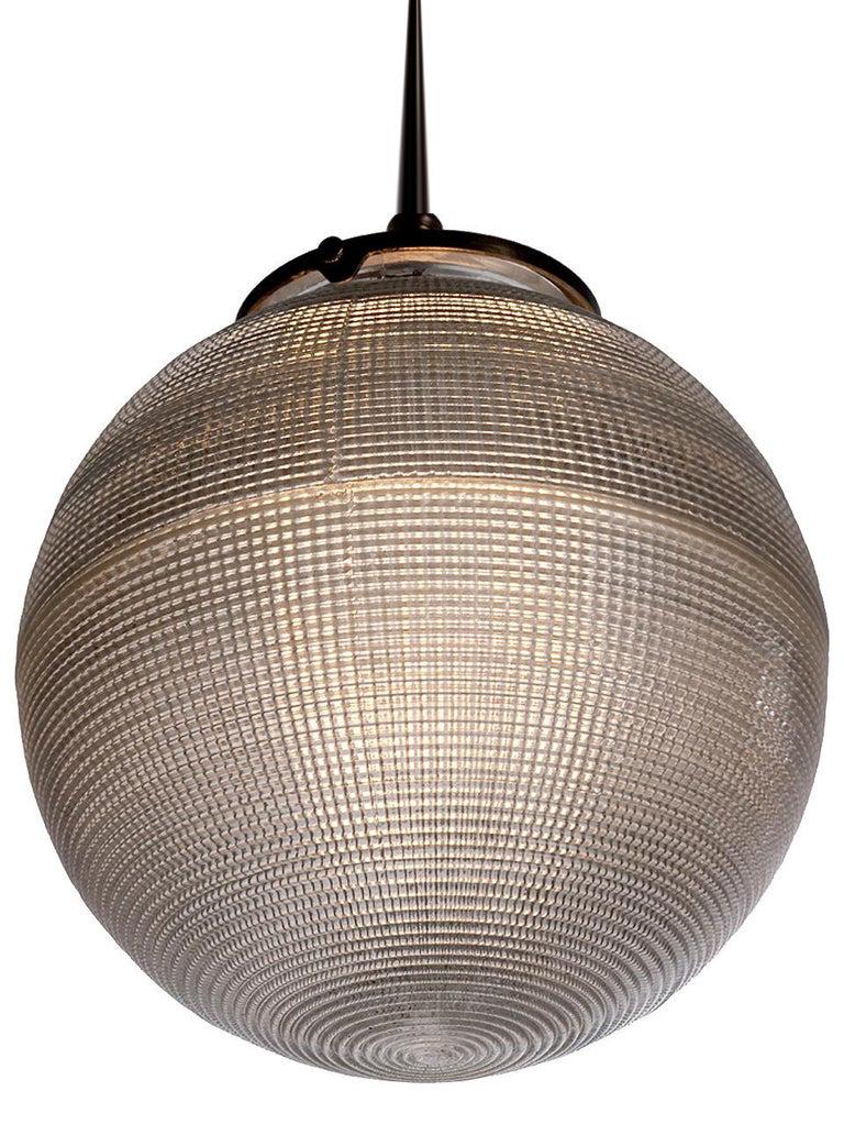 We have a nice collection of these prismatic lamps. The impressive 9 inch diameter is simple, pleasing and gives off a beautiful even light. They are a smaller globe inspired by the larger Paris street lamps. These unique 9 inch diameter 1920 style