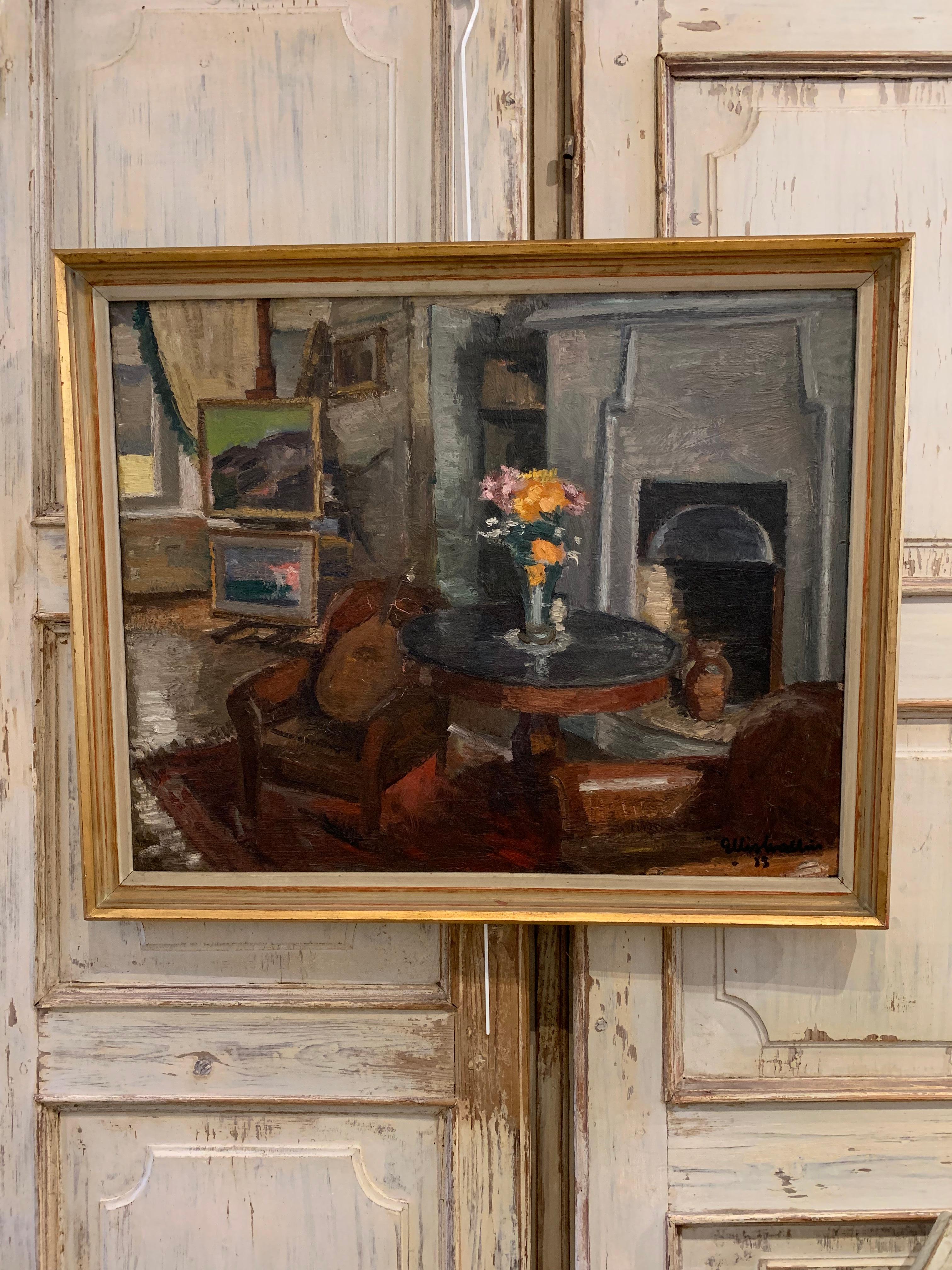 Painted by Swedish artist Ellis Wallin this framed oil on canvas shows a charming study of an interior.
The room in the foreground shows a fireside scene, a comfortable pair of leather chairs a stringed instrument casually laid on one by a classic