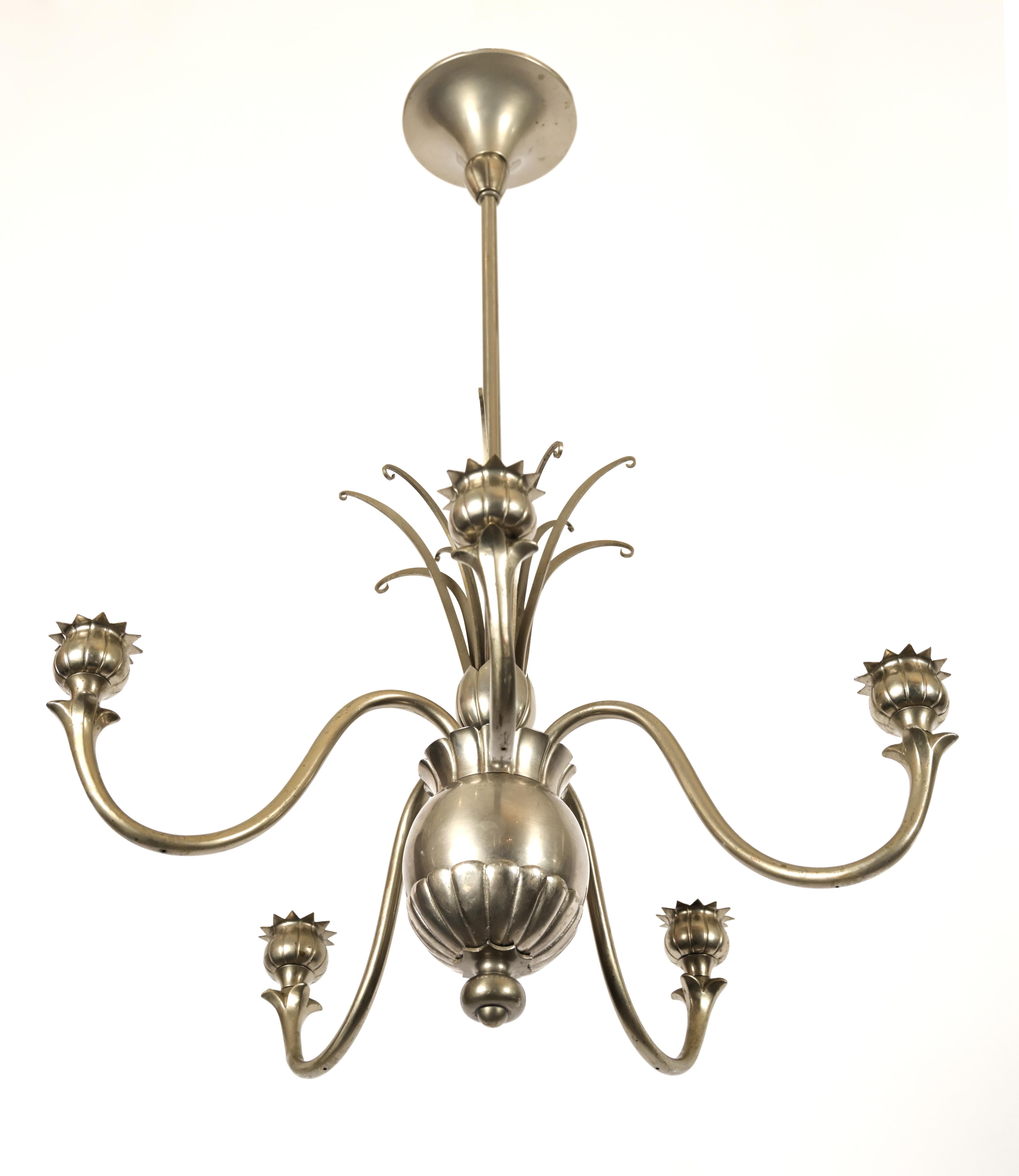 A Swedish Grace Period Tole Pewter chandelier with 5 curved upward arms having spike bulb bases. The center is decorated in a pineapple like manner with an orb center and spiked leafage. Standard wiring included in pricing. 

