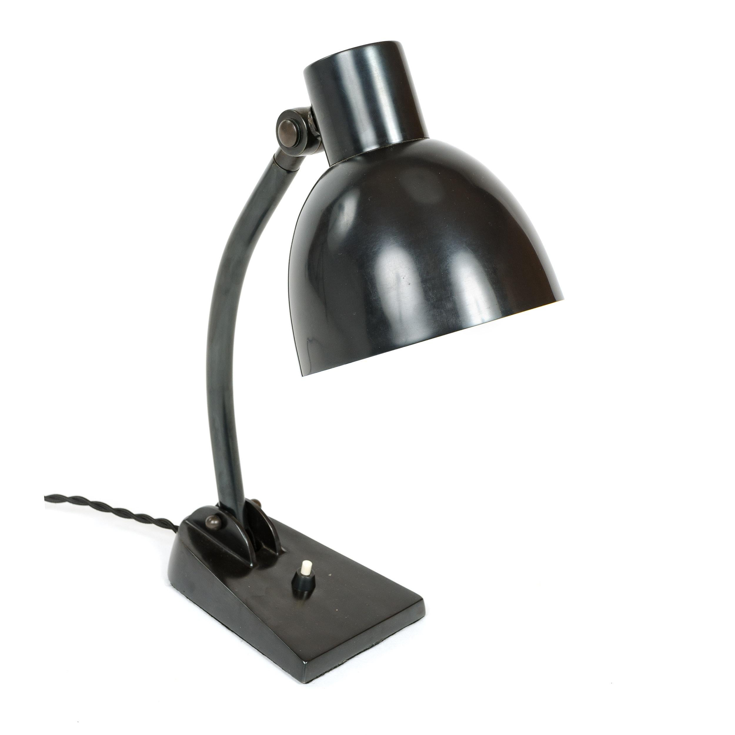 Bauhaus period, fully functional, articulated metal table lamp produced by B.A.G. Turgi in the 1930s. Adjustable metal shade pivots up and down and swivels left to right attaching to an arm jointed at the base allowing for a wide latitude of forward