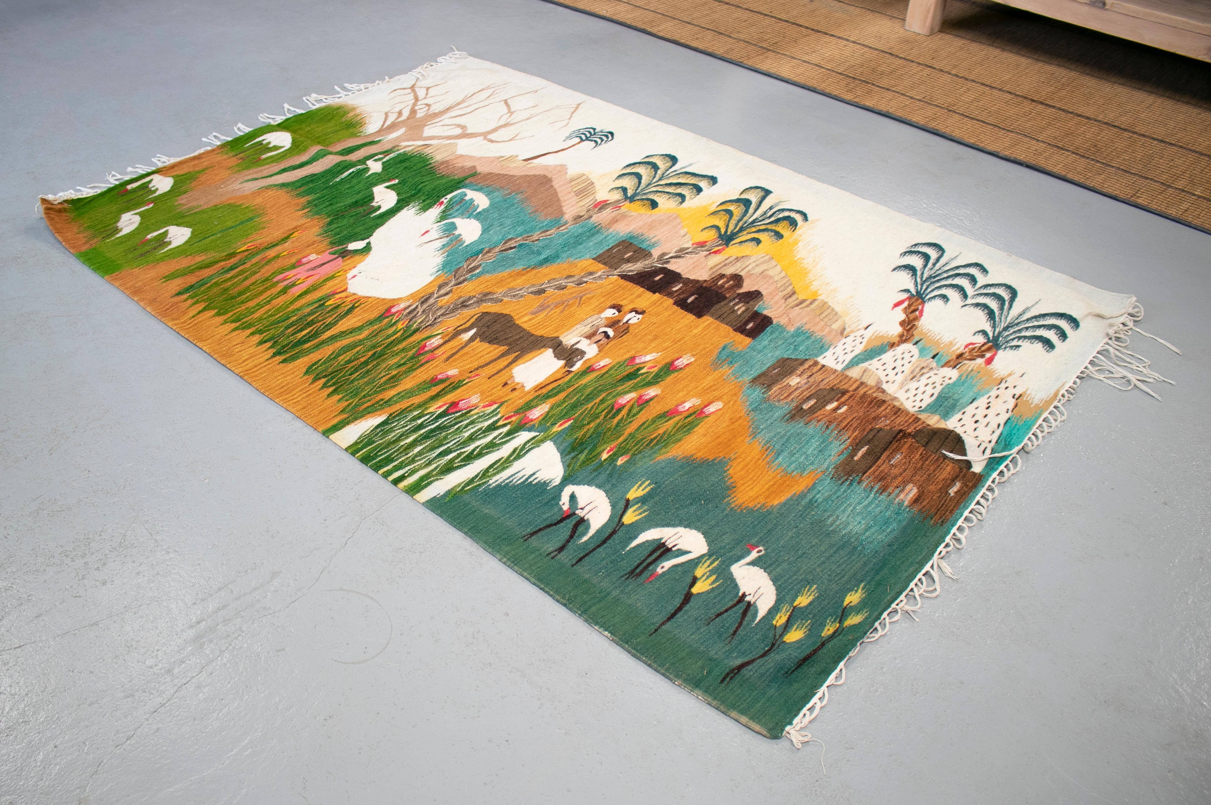 1930s handmade tapestry representing a Nile nature scene with animals, palm trees and a farming village.

Part of a set of Tapestries that represent Egyptian life in the 1930s.
