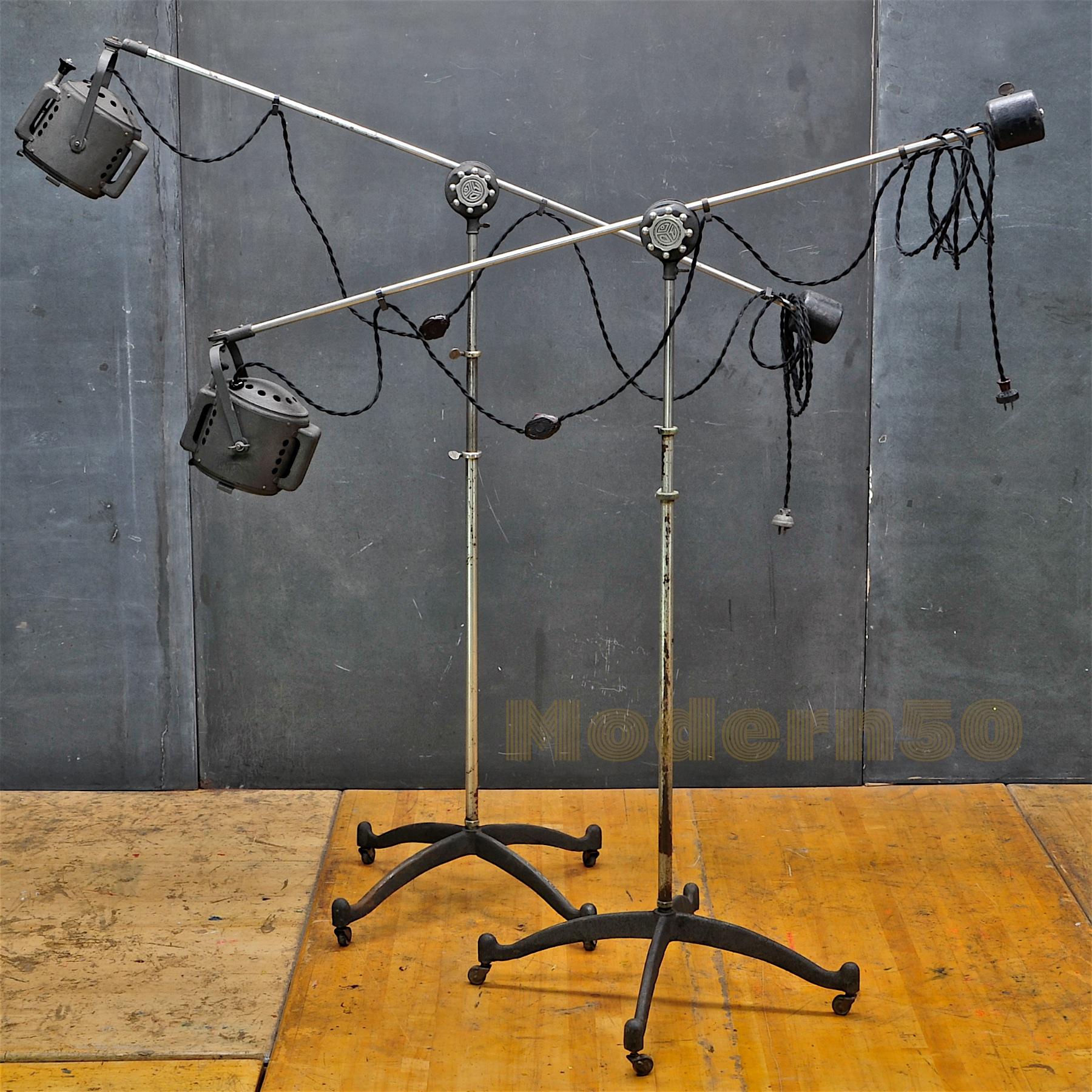 Wild studio lights. Pair. Vintage industrial photogenic machine company Theater TV Studio floor lamps. Rewired with original line switches. 

Measures: W 55 x D 25 x H 38 to 82 in. (Height Measured from Floor to Knuckle Knob).