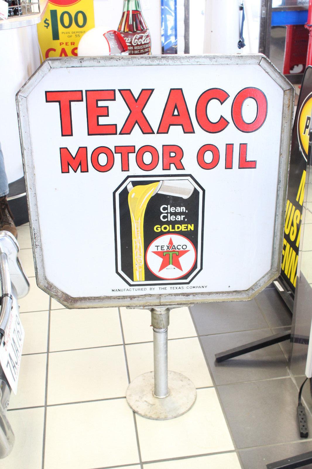 Classic and is still absolutely vibrant! This Texaco advertising sign is double sided and was normally used on the curbside or near a sidewalk. That would make this sign visible from either direction. Heavy duty porcelain with great graphics of