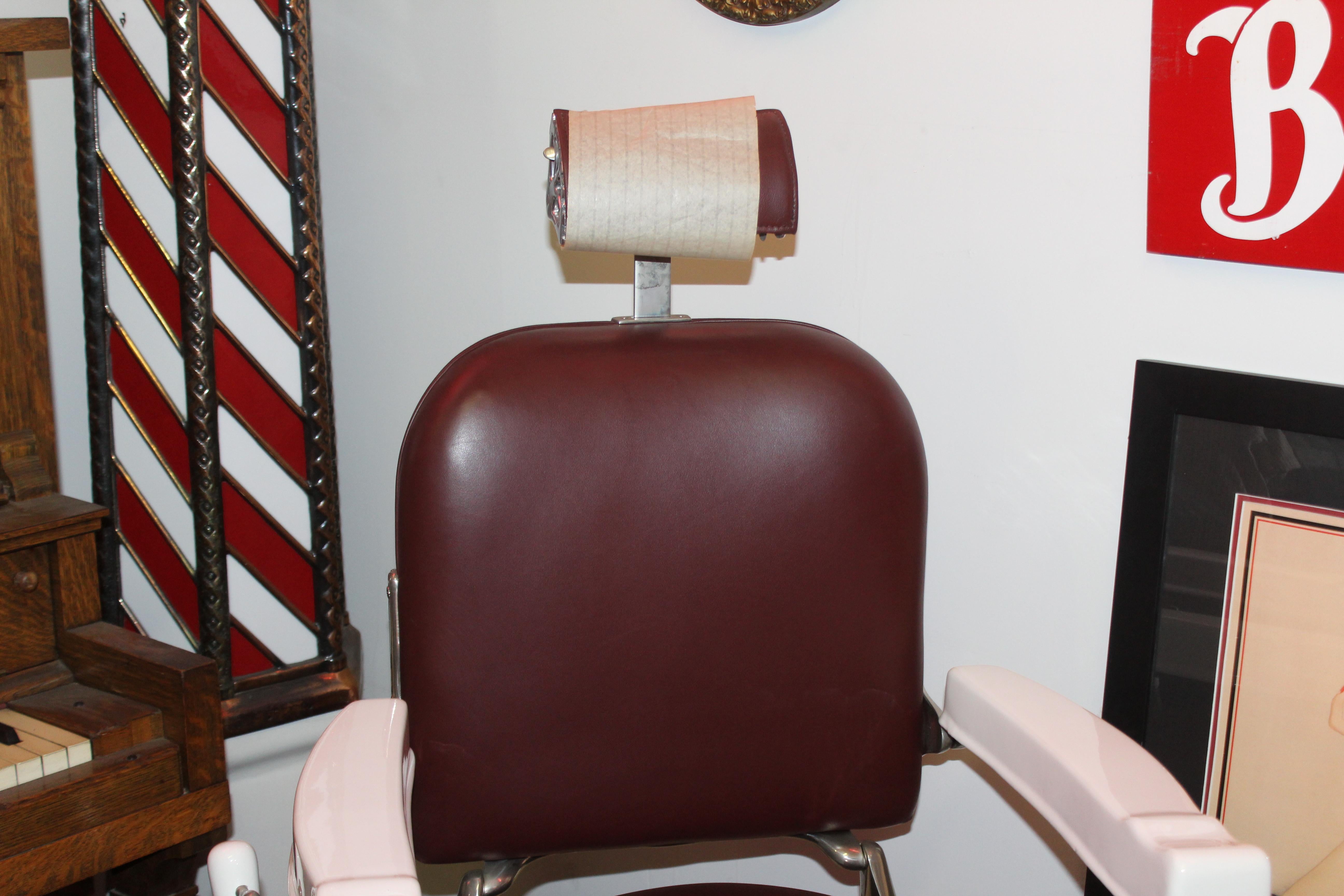 Fully restored barber chair. Powder coated, burgundy leather upholstery and chair has been nickel plated. Everything is in working order.