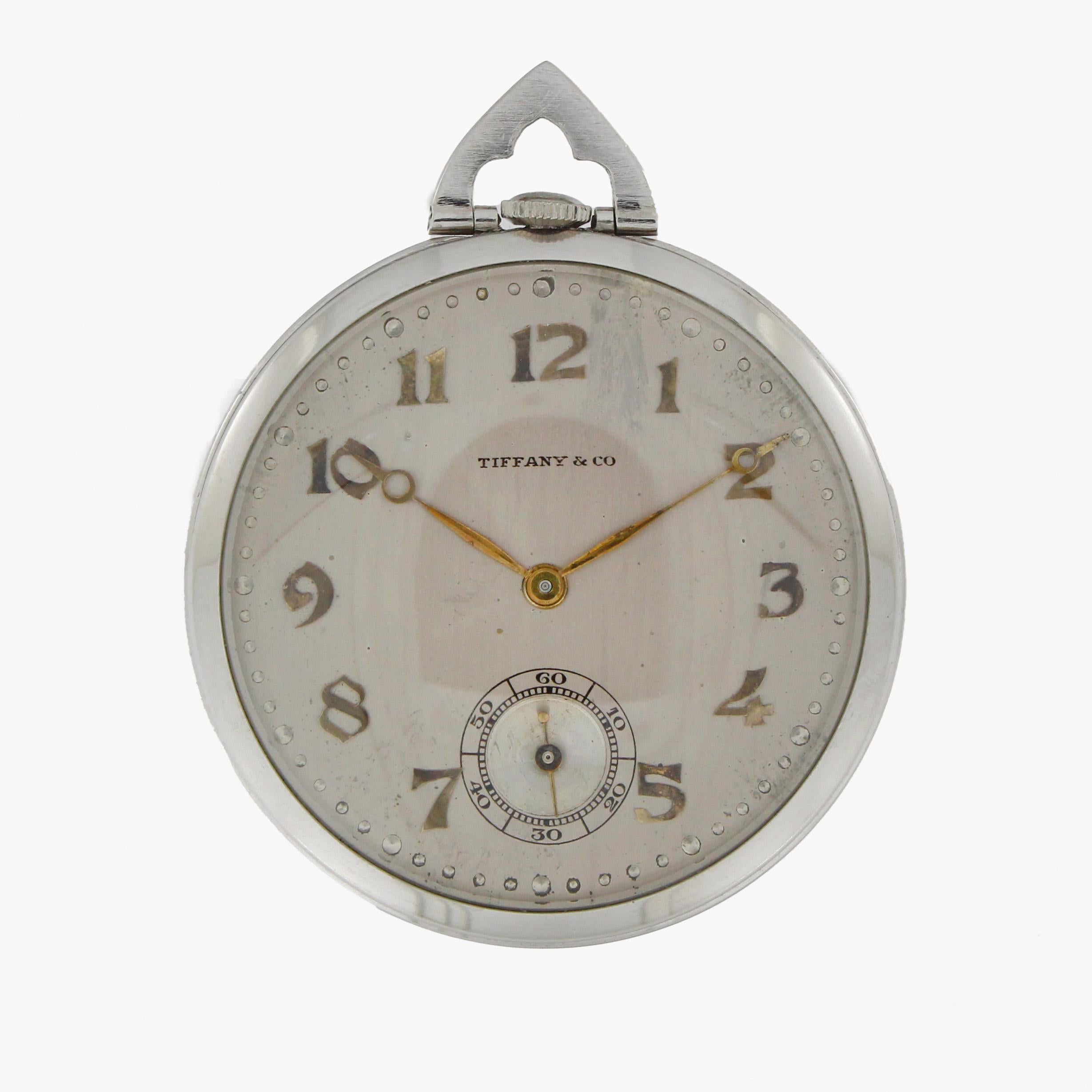 Tiffany & Co. Pocketwatch with a silver colored dial, brass colored numbers and hands with a 42mm diameter platinum case. Manual winding movement by Touchon & Co. with 19 jewels