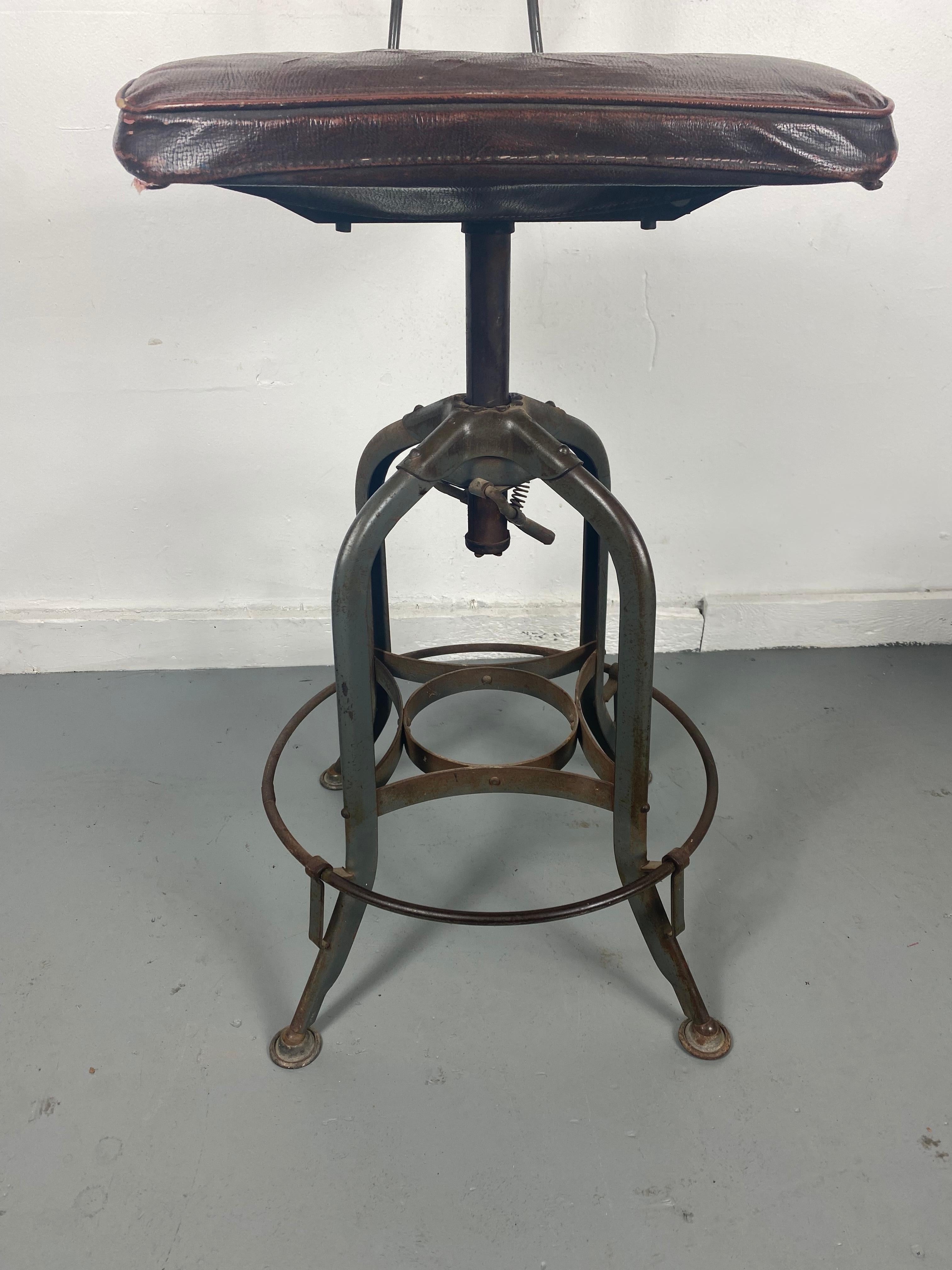 Mid-20th Century 1930s Toledo Industrial Adjustable Height Swivel Stool .Orig Oil Cloth Covers