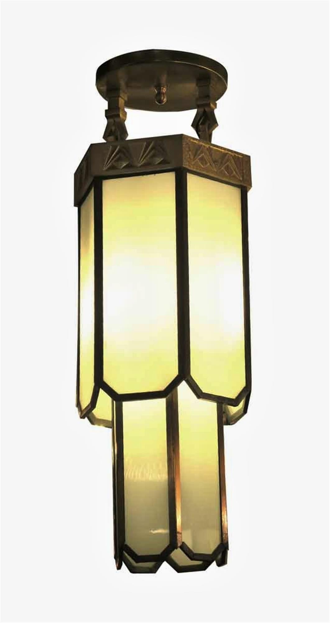 Two-tier Art Deco gilded bronze and leaded glass pendant light from the 1930s. Three sockets. This was salvaged from the Hamilton manufacturing plant in Two Rivers, WI. This can be viewed at one of our New York City locations. Please inquire for the