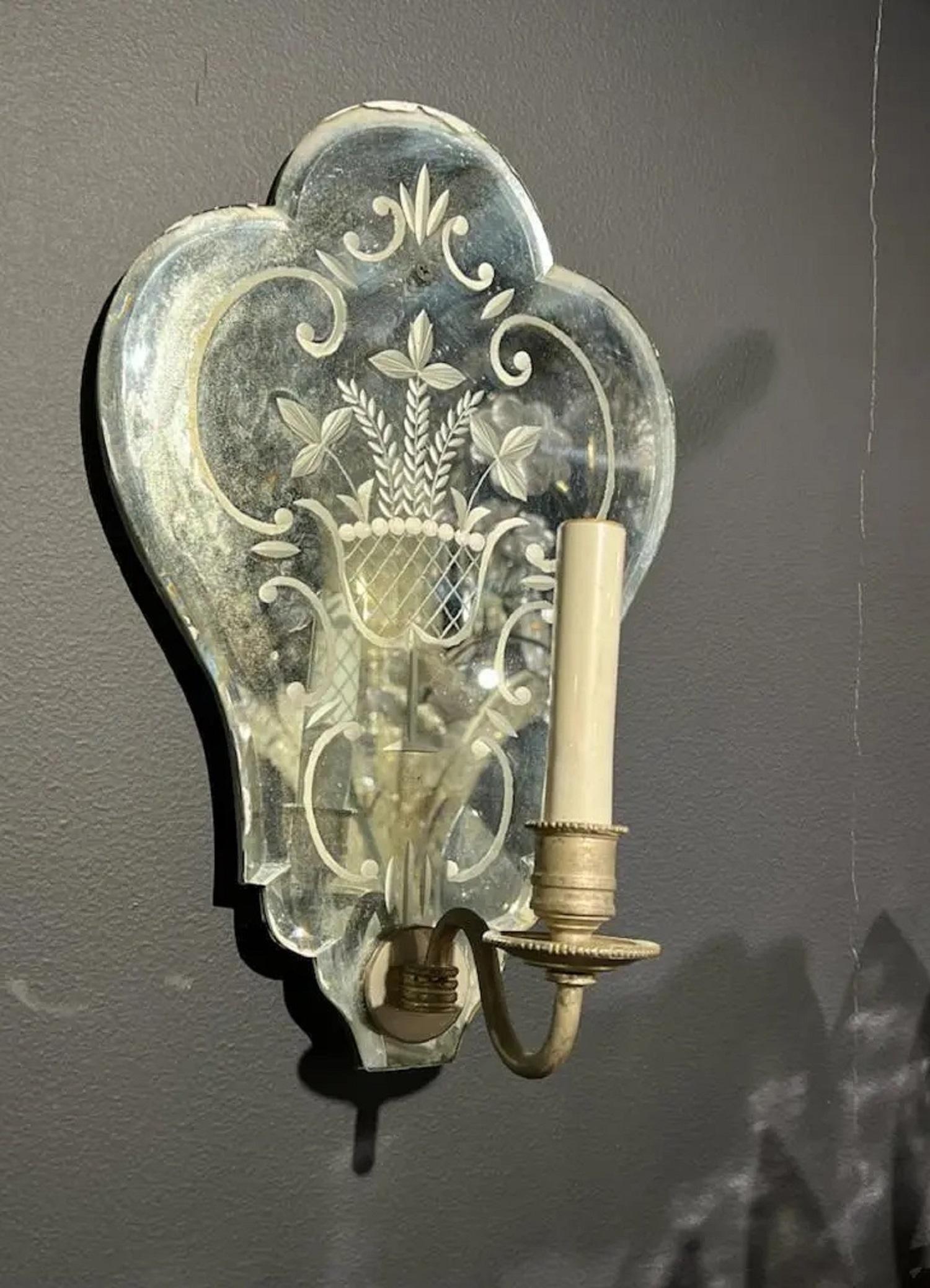A pair of circa 1920’s Venetian etched mirrored backplate sconces 