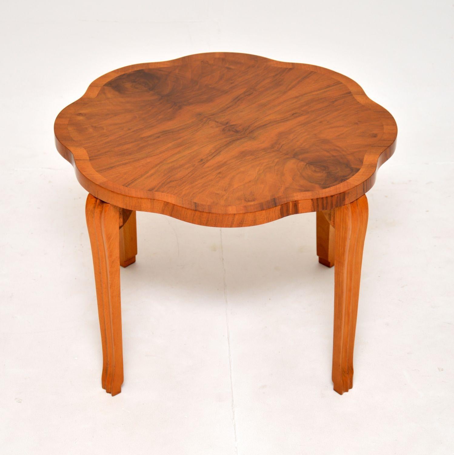 A stylish and very well made original Art Deco period coffee / side table in walnut. This was made in England, it dates from the 1930’s.

It is of exceptional quality, with a lovely thick flower shaped edge, sitting on nicely crafted legs.

The