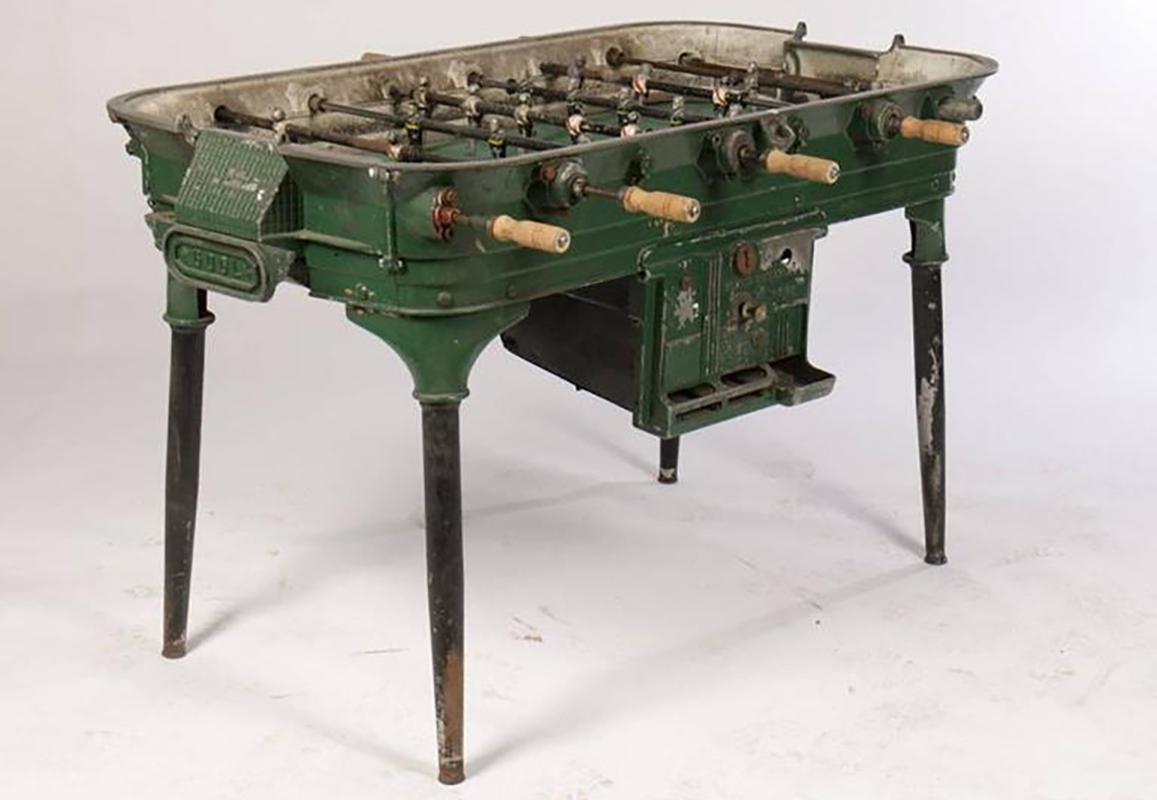 Foosball started as a parlor game in the 1800s in Europe. Today, these vintage tables can be used as decorative pieces that add a cool element to any room. This piece is made of cast metal and labeled 