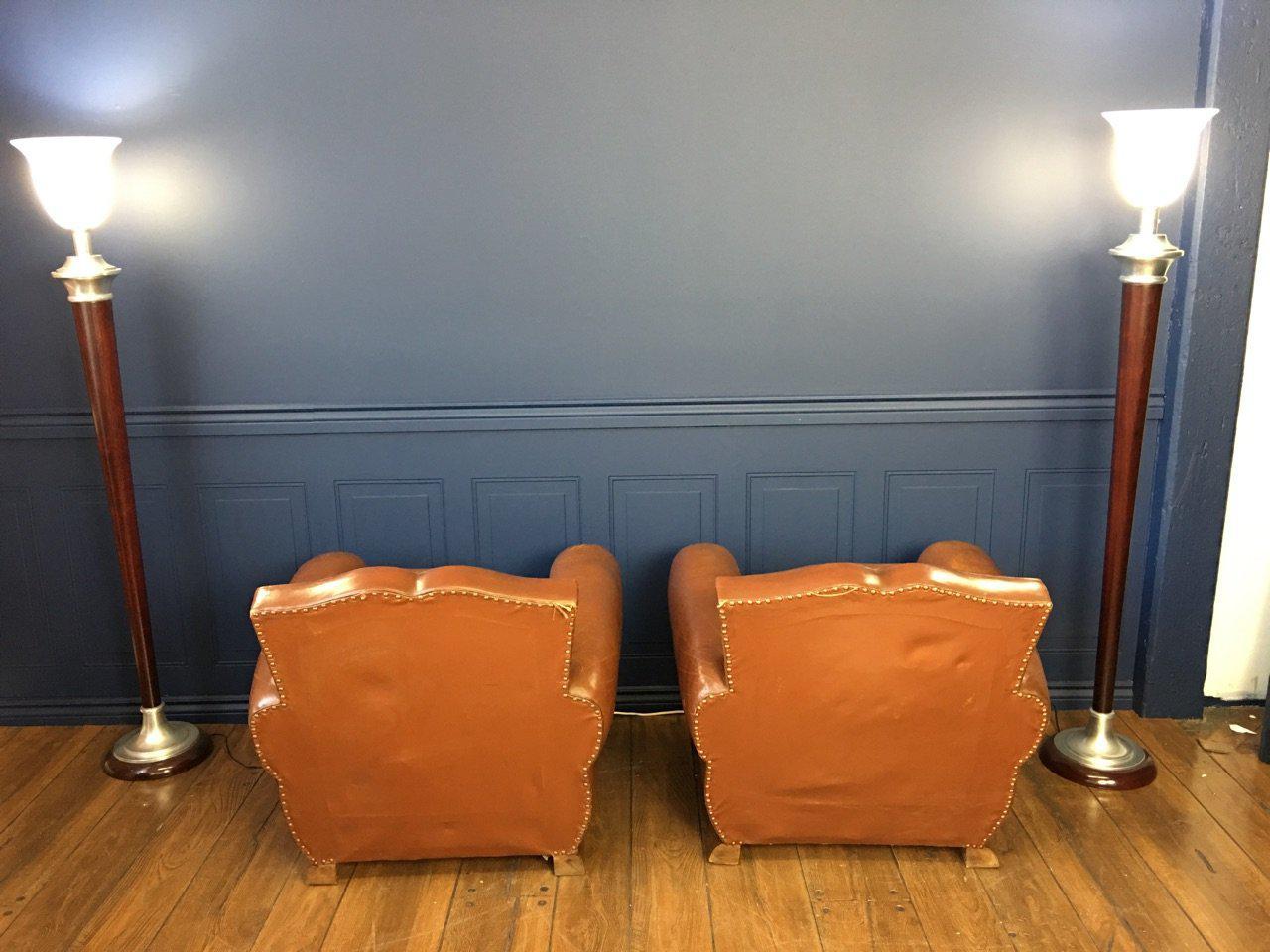 Pair of moustache original Art Deco French leather club chairs, circa 1930s with spectacular soft and supple original leather. This is a beautiful, highly coveted moustache clubs pair with a lot of character and charm. Extremely comfortable. In very