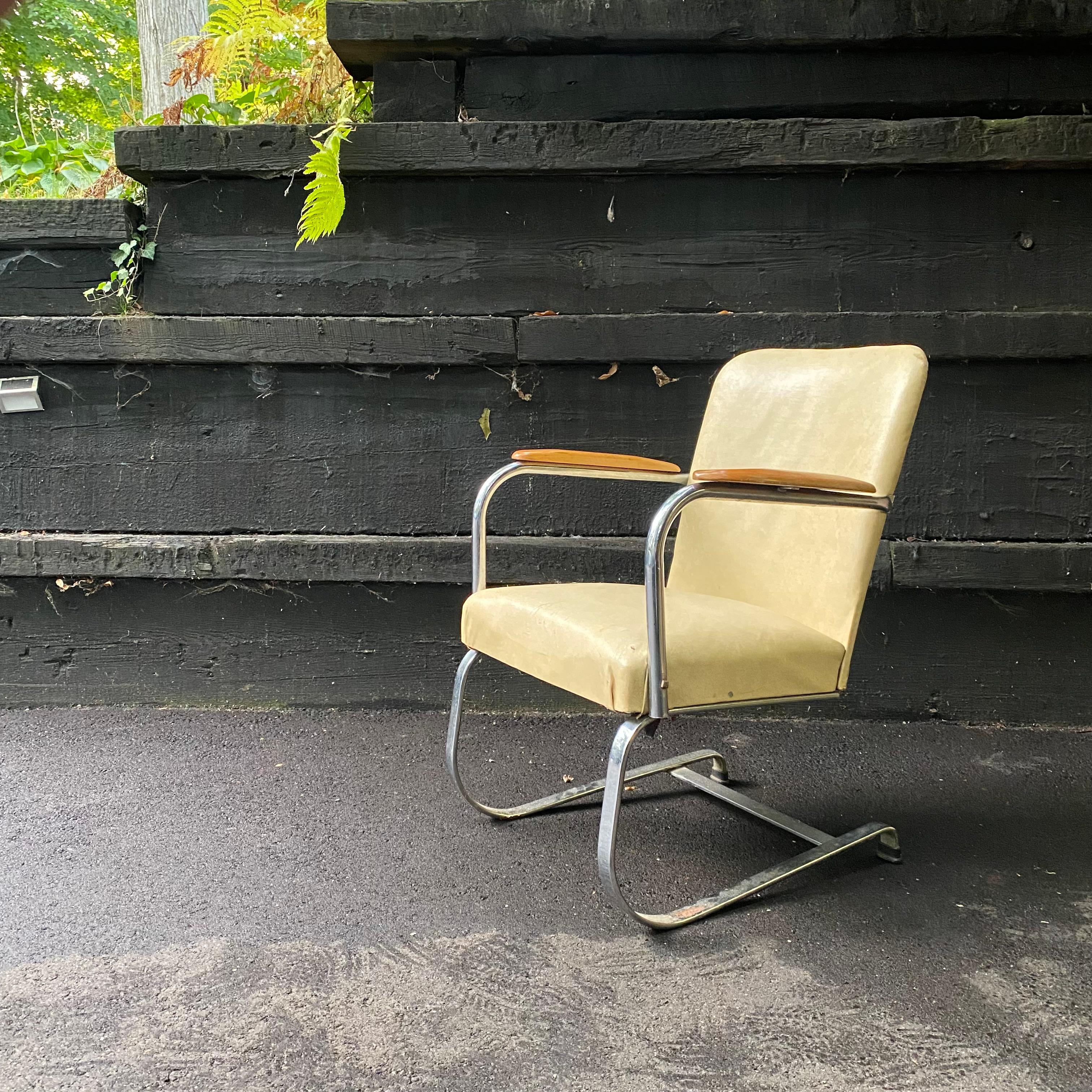 This is a beautiful spring cantilever chrome lounge chair with wood arms in yellow vinyl designed by Kem Weber for Lloyd Manufacturing Co, later Heywood Wakefield, ca. 1930's.

Condition: This chair is being offered as is either for restoration or