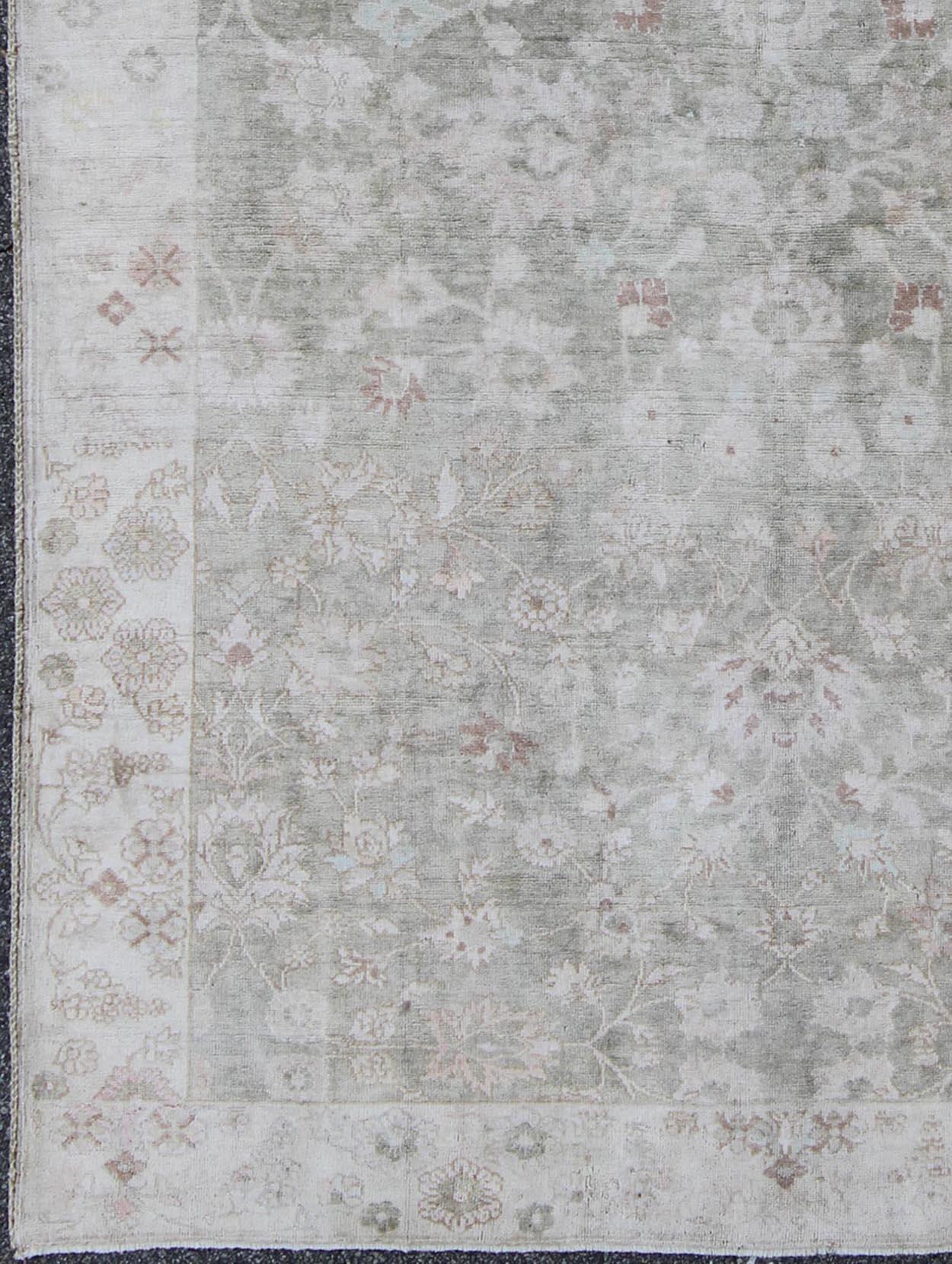 Hand-Knotted 1930's Vintage Turkish Muted Oushak with All-Over Floral Design and Border For Sale