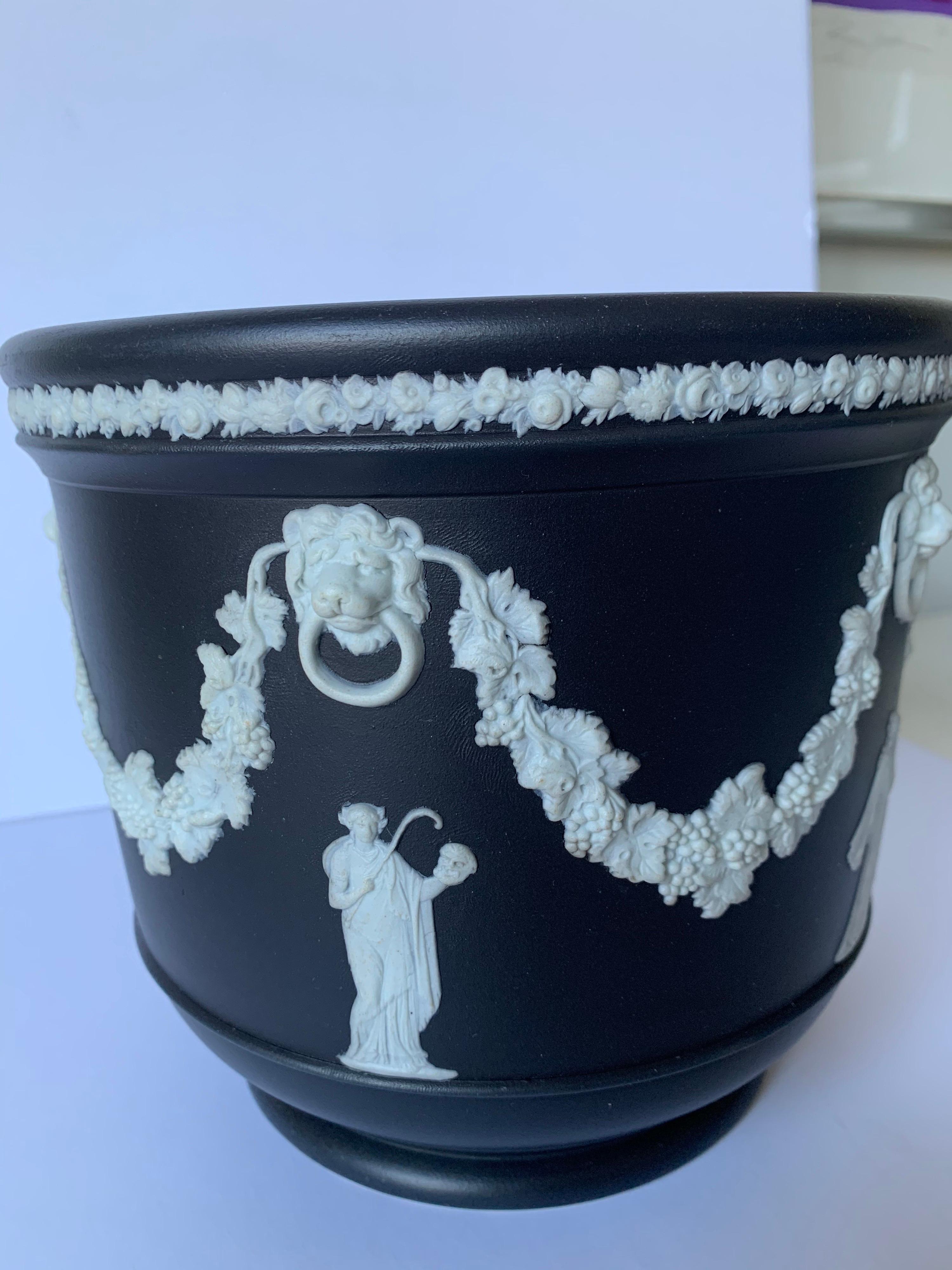 1930s Wedgwood medium size basalt black cache pot/ flower pot. Overall neoclassical motif. Stamped on the underside.