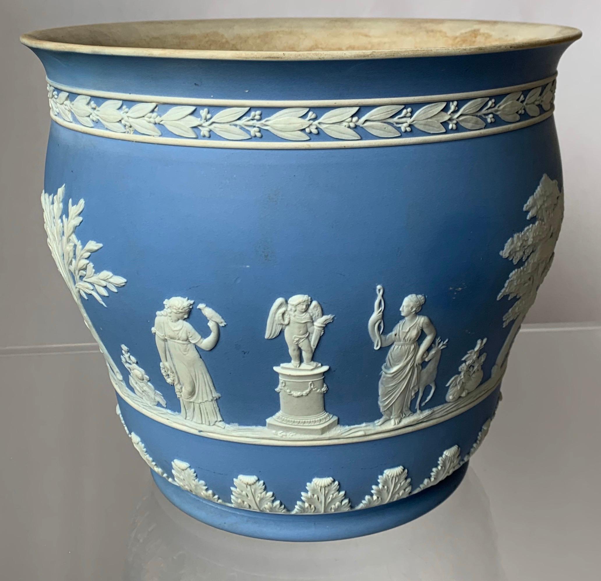 1930s large Wedgwood jasperware flower pot. Light blue jasperware with all-over white neoclassical motif. Signed on the underside.