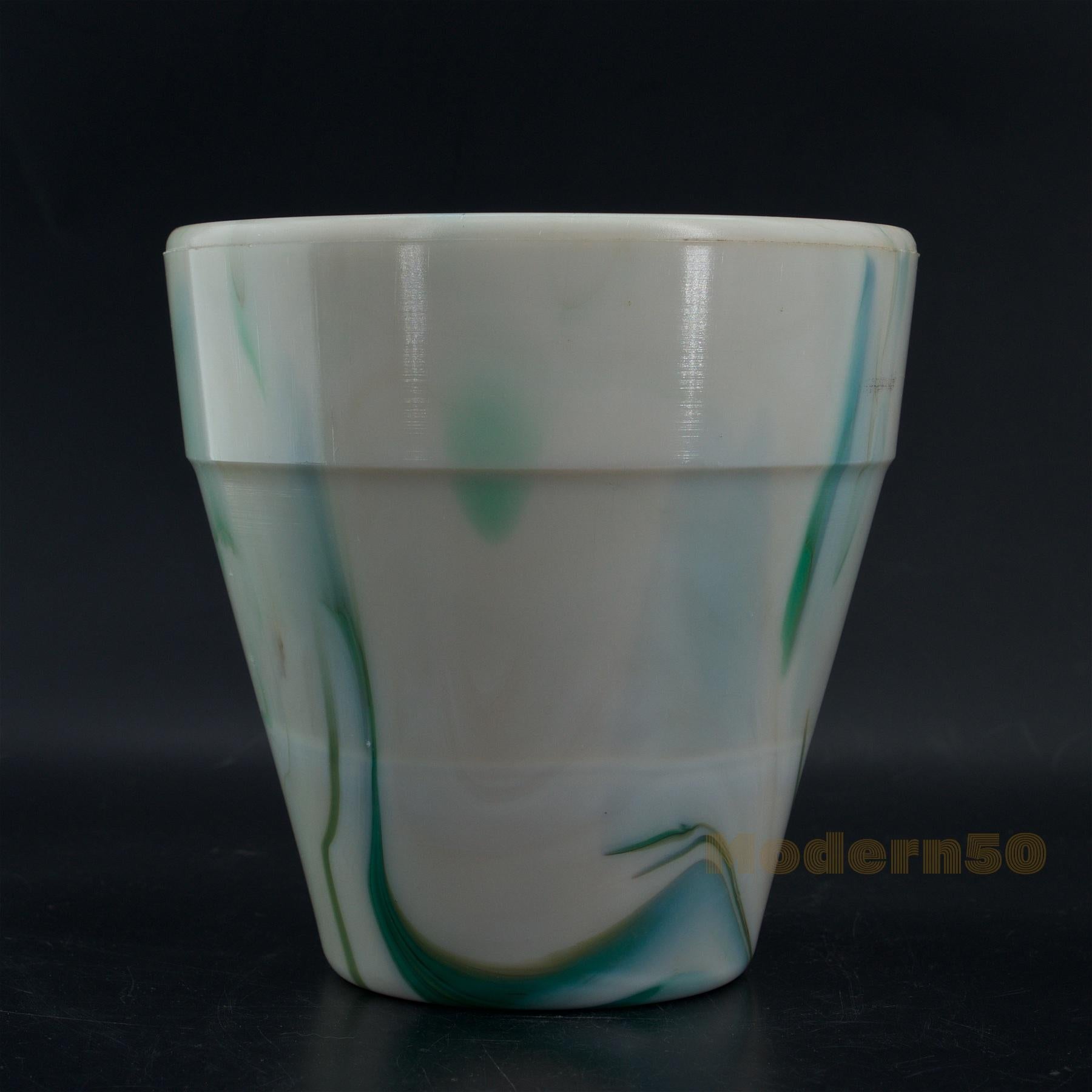 Westite Glass Company #302 bow tie flower pot. Green and cream slag. Tapering traditional form flower pot with rim. Embossed on base: 