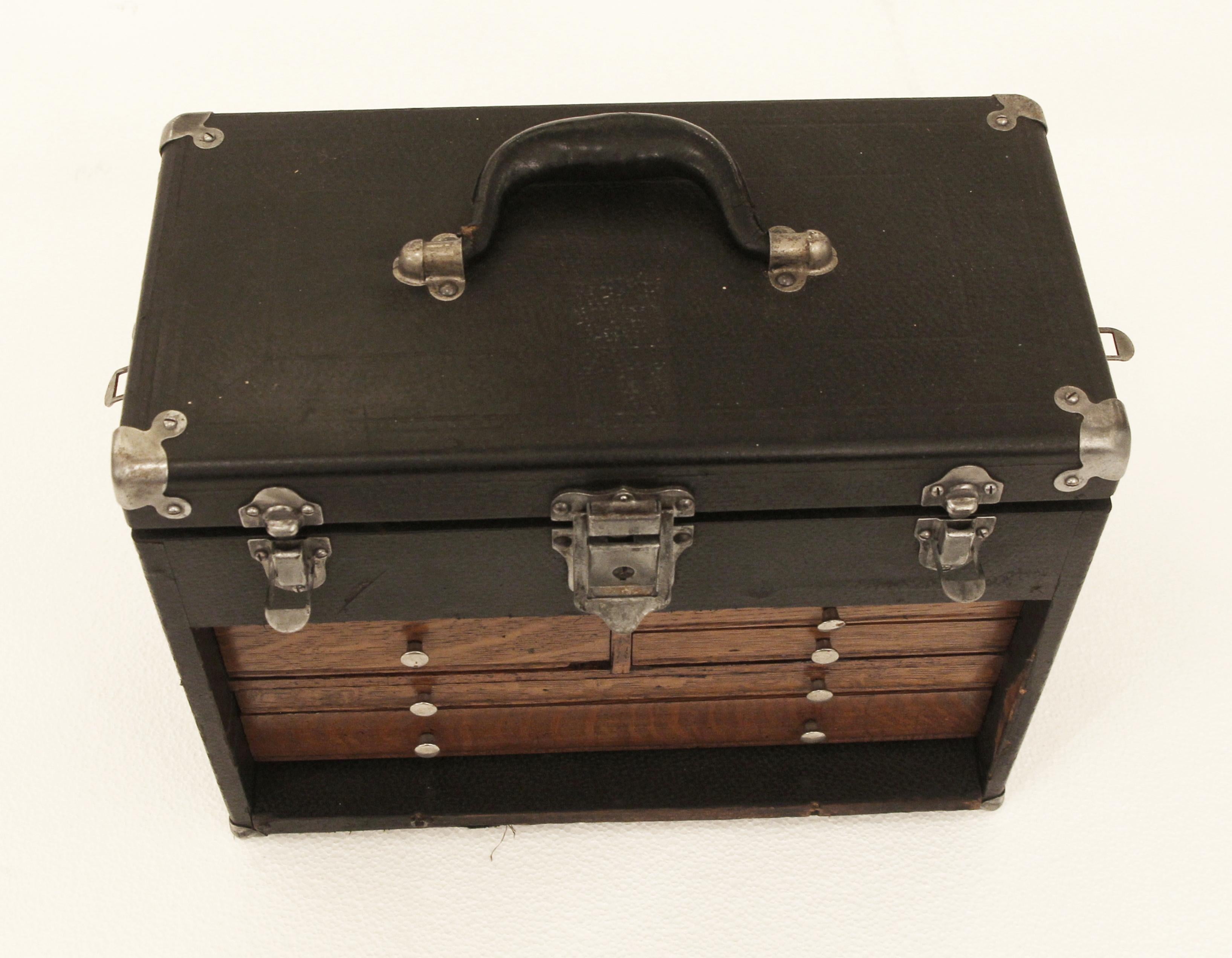 This vintage oak wooden machinist box is painted black and has a green felt lining. Perfect for storage, circa 1930. This item can be seen at our 5 E. 16th Street New York City location.

  