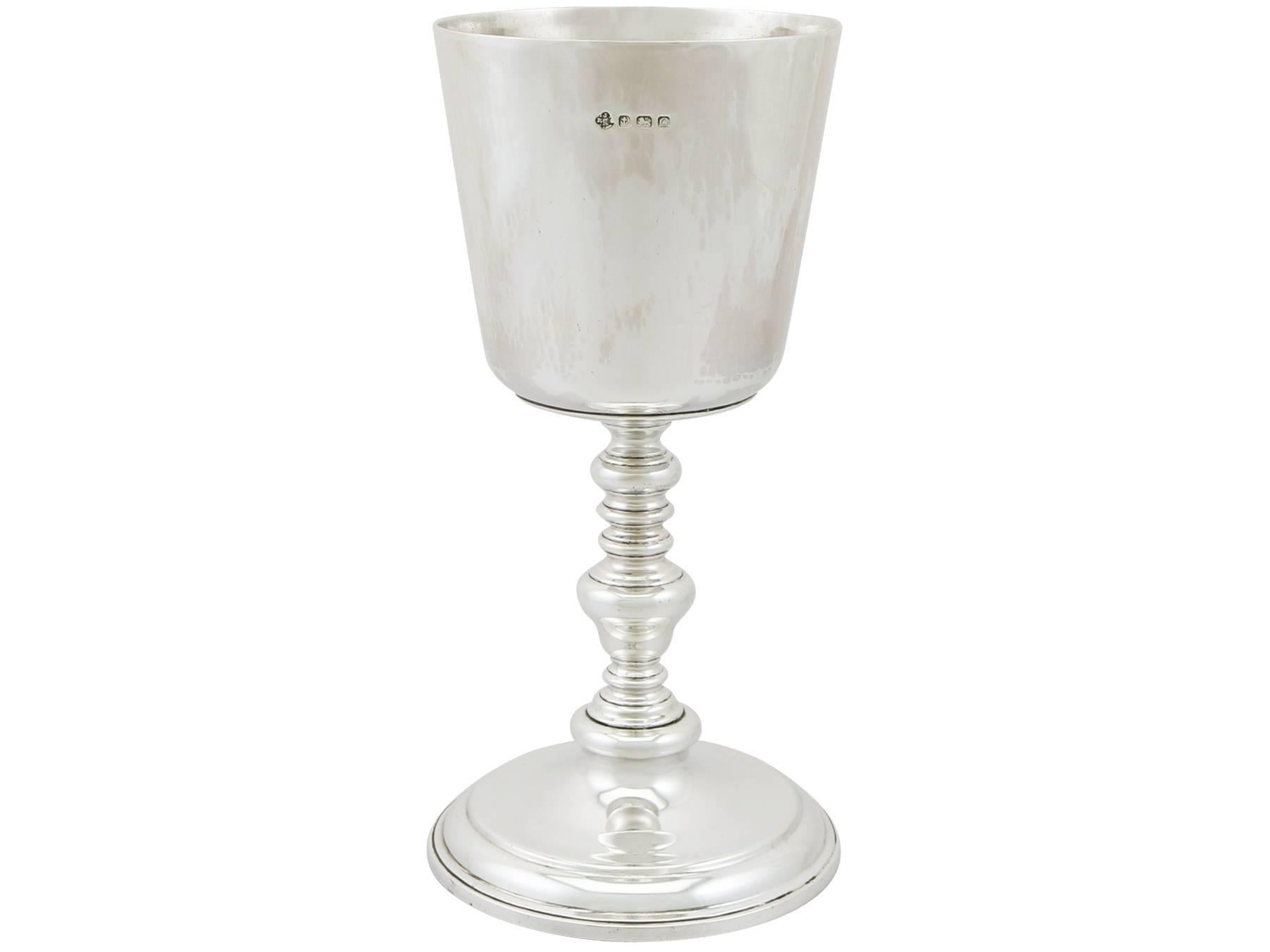 An exceptional, fine and impressive, large antique George V English sterling silver chalice; an addition to our collection of wine and drinks related silverware.

This exceptional antique George V English sterling silver ecclesiastical chalice has