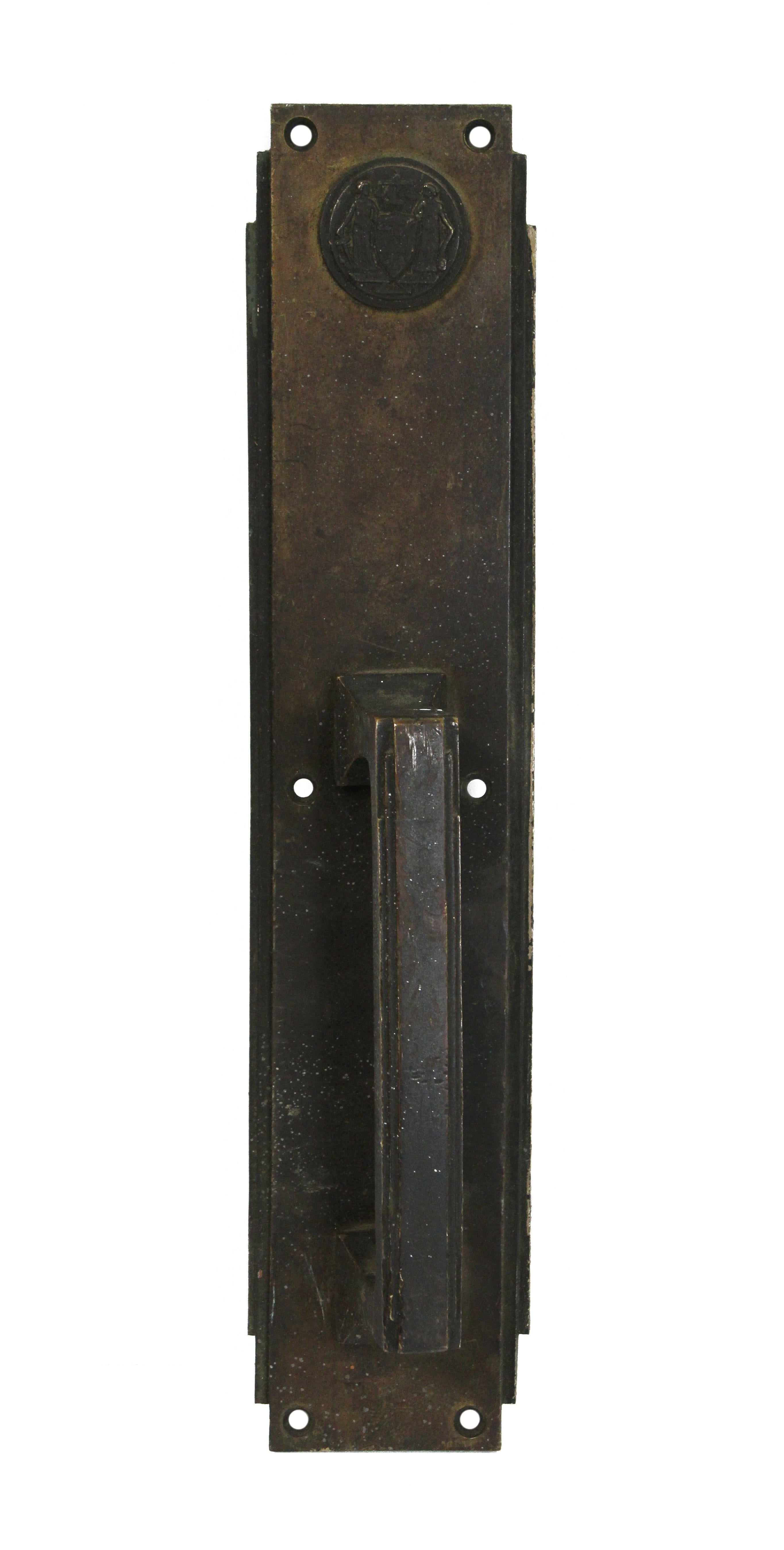 1931 Corbin signed bronze door pull and push plate set with emblems and a dark patina salvaged from the Philadelphia Civic Center. This pair is made for the front and back of one swinging door. Salvaged by Olde Good Things from The Philadelphia
