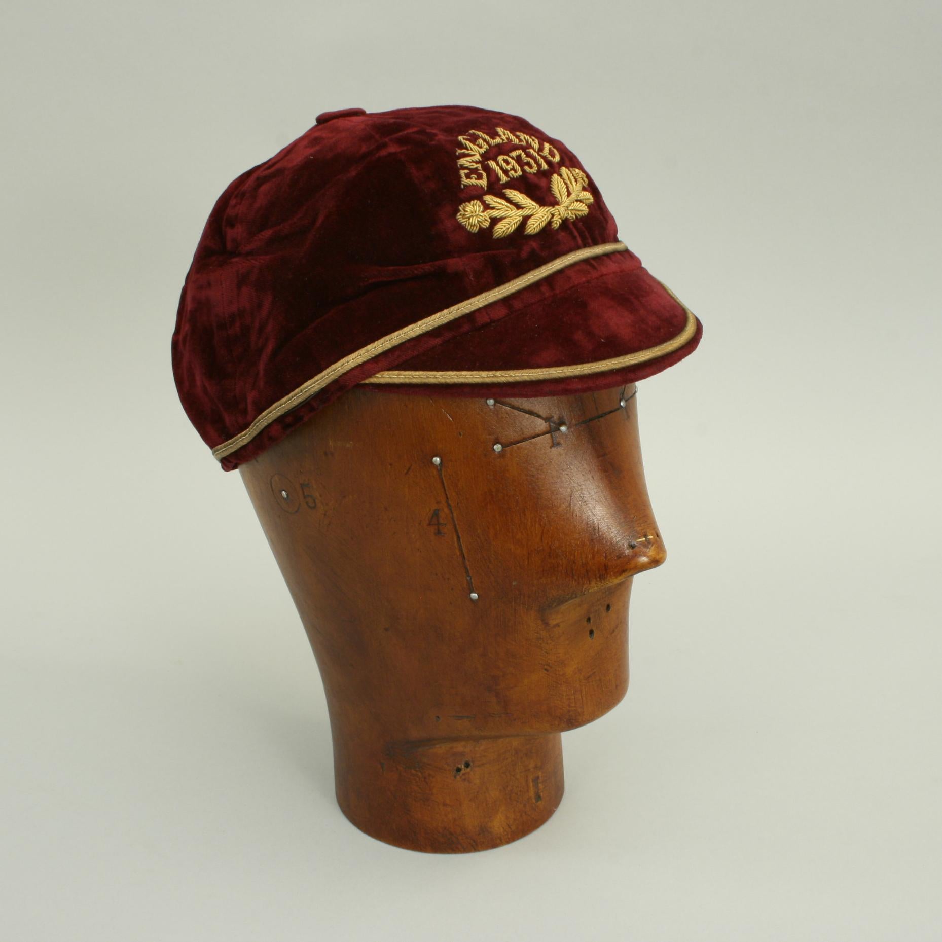1931 England International Cap.
A wonderful red velvet Cap in fine condition with gold braid trim. The Cap also has a gold braid embroidered date of '1931' with two roses and the word 'England'. This was the property of William Martin (1906-1980)