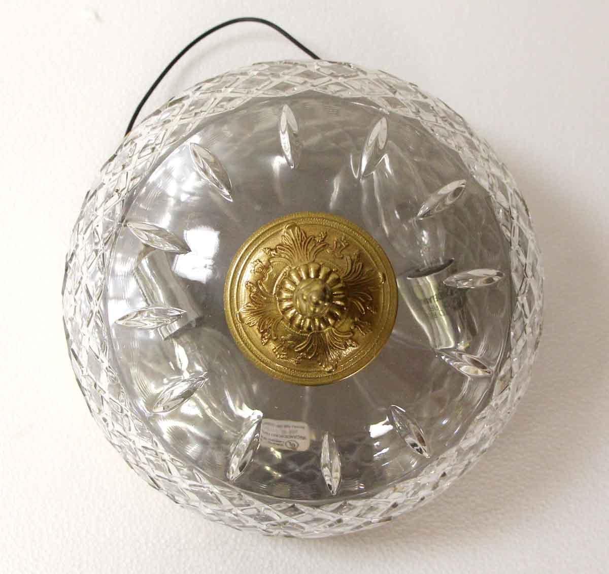 20th Century crystal flush mount light fixture with an ornate brass rim and long finial. From the Waldorf Astoria Towers on Park Ave. Waldorf Astoria authenticity card included with your purchase. Small quantity available at time of posting. Please