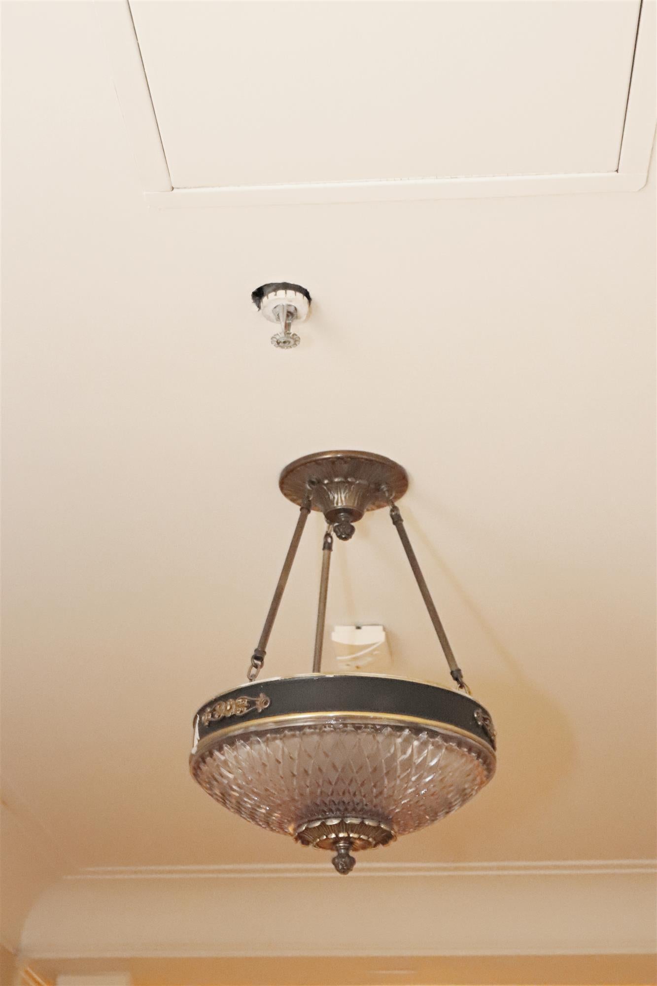 1931 Empire style chandelier pendant with cast glass dish and bronze details. These elegant lights graced many of the main corridors of the NYC Waldorf Astoria Hotel. A Waldorf authenticity card is included in your purchase. This can be seen at our