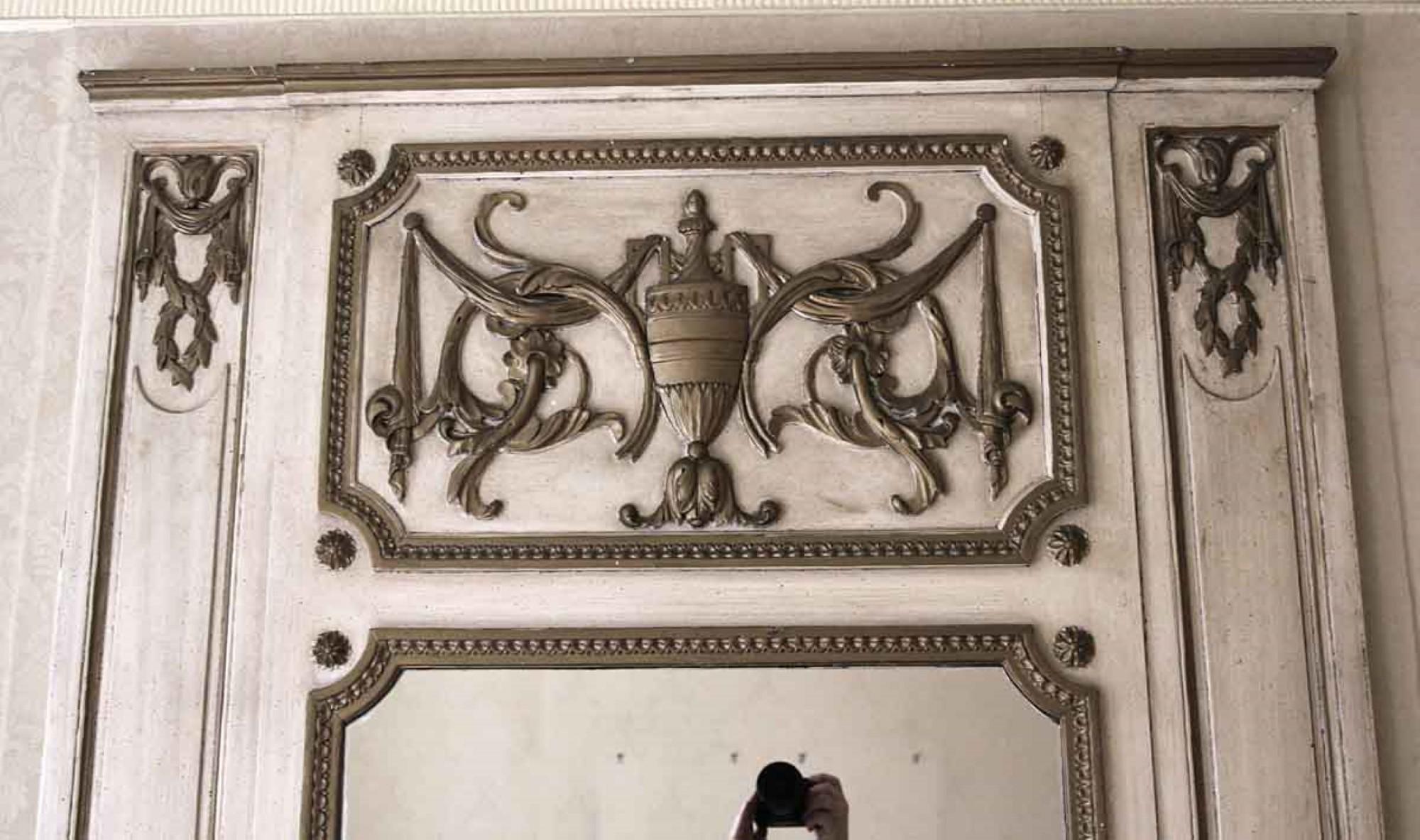 Tan wood over mantel mirror with hand carved details and an urn motif in the top center. Original to the 1931 NYC Waldorf Astoria Hotel suite 965. Mantel in photo is no longer available. Waldorf Astoria authenticity card included with your purchase.