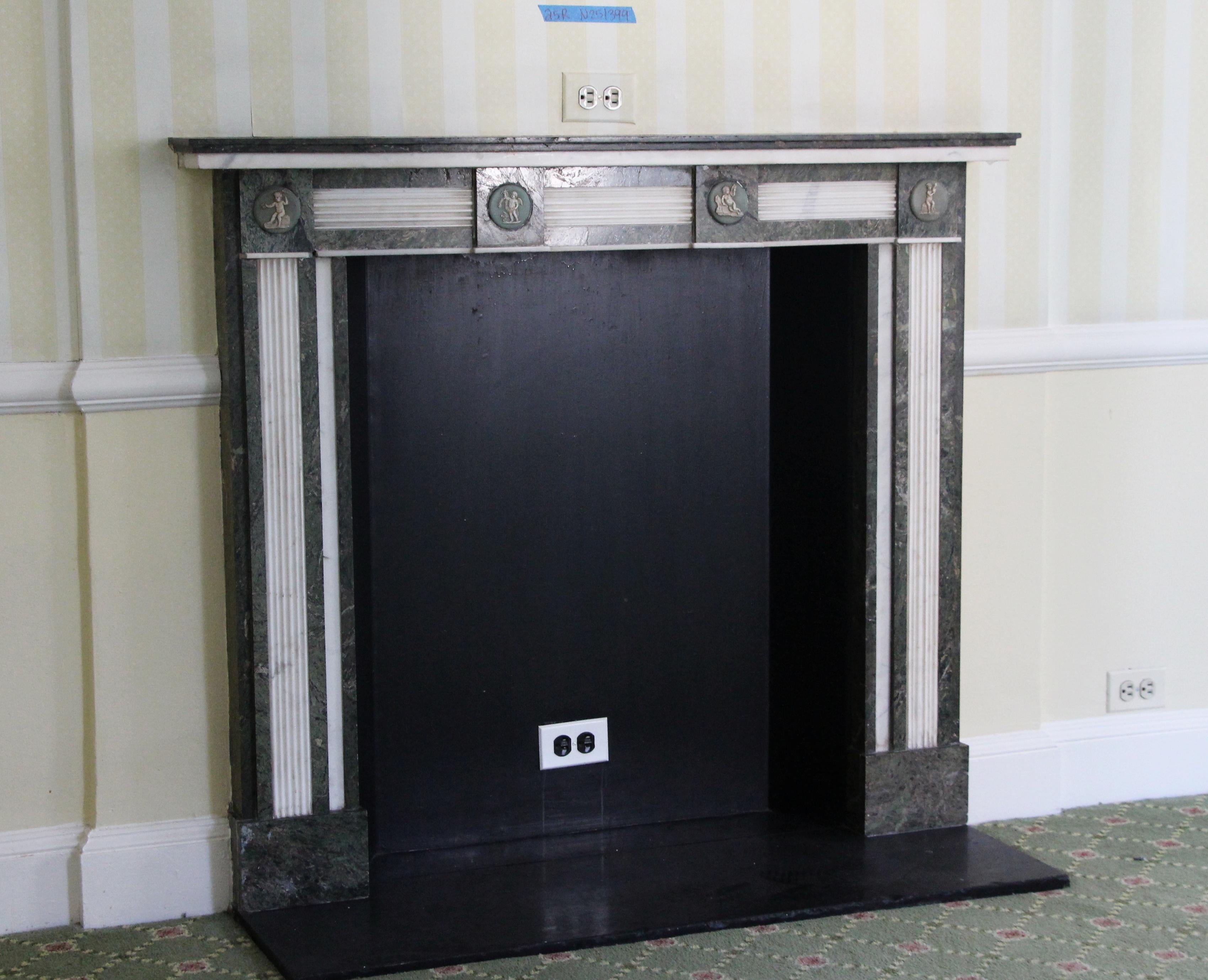 Heath not available. This mantel was one of a group of antique mantels imported from Europe and installed in the Waldorf Astoria hotel in 1931 when the hotel was first built on Park Avenue, circa 1890s, France. This gray and white marble mantel with