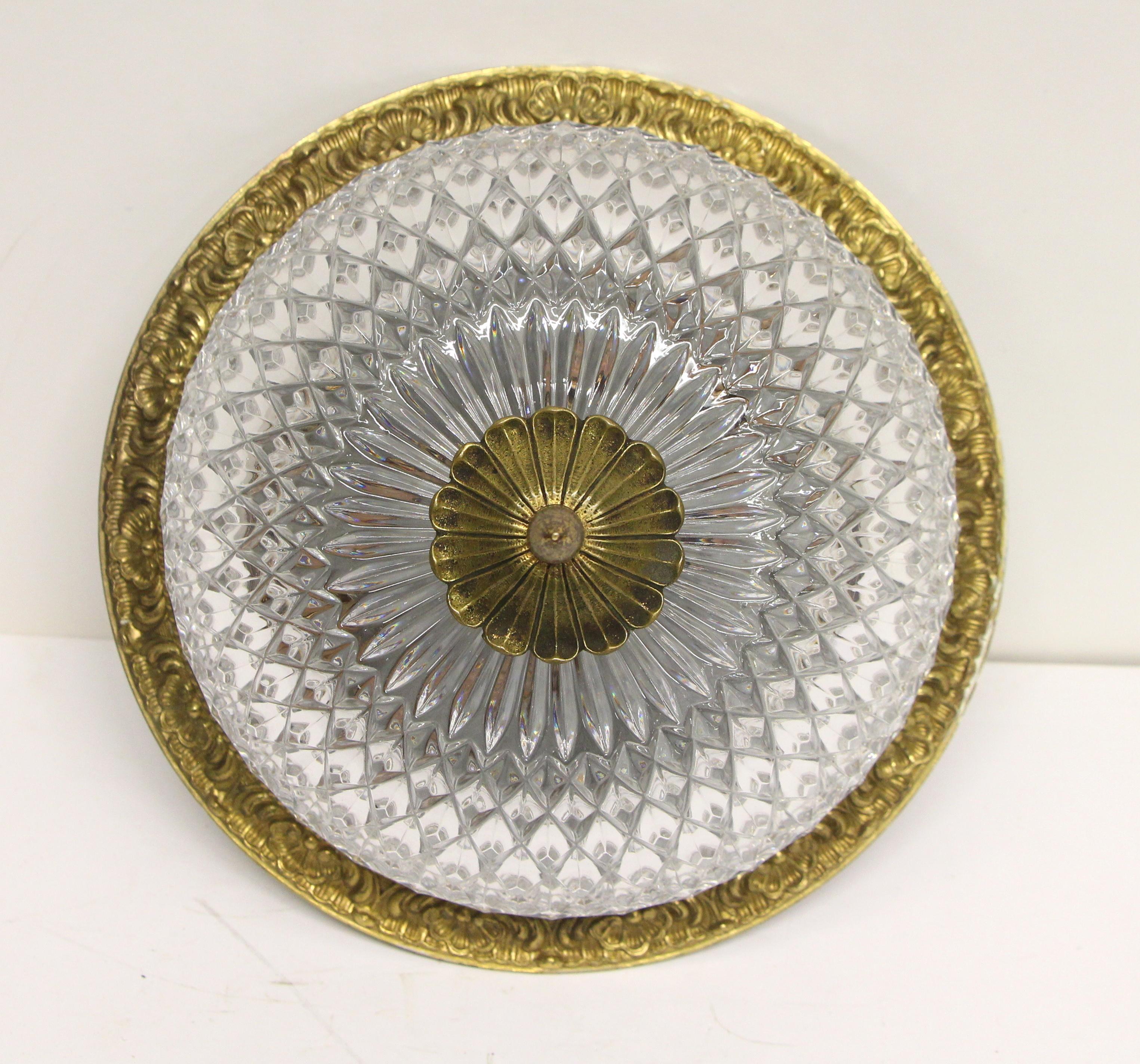Clear cut crystal flush mount light with an ornate cast brass rim and finial. From the 1931 Waldorf Astoria Hotel Towers. A Waldorf Astoria authenticity card included with your purchase. This can be viewed at our Scranton, Pennsylvania location.