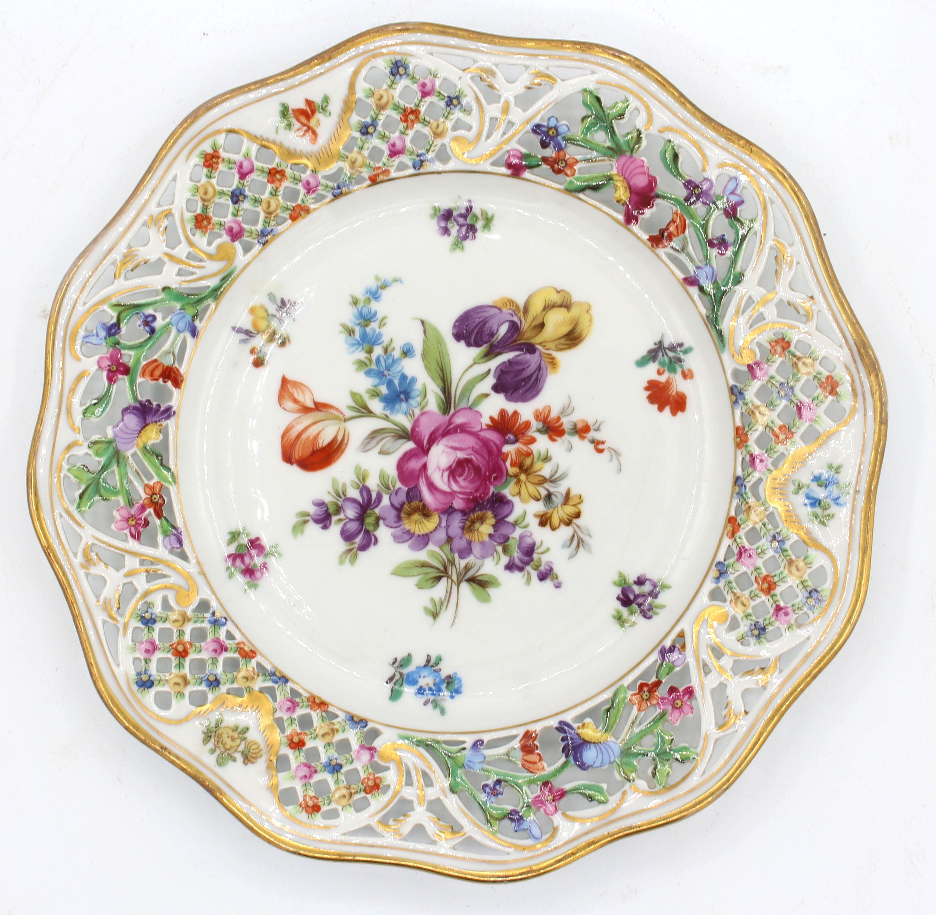 1932-1944 set of 8 Dessert Plates by Schumann, Dresden & Bavaria periods. Superbly handpainted floral sprays with bold reticulated undulating wide floral borders. One glaze line.
8 3/8