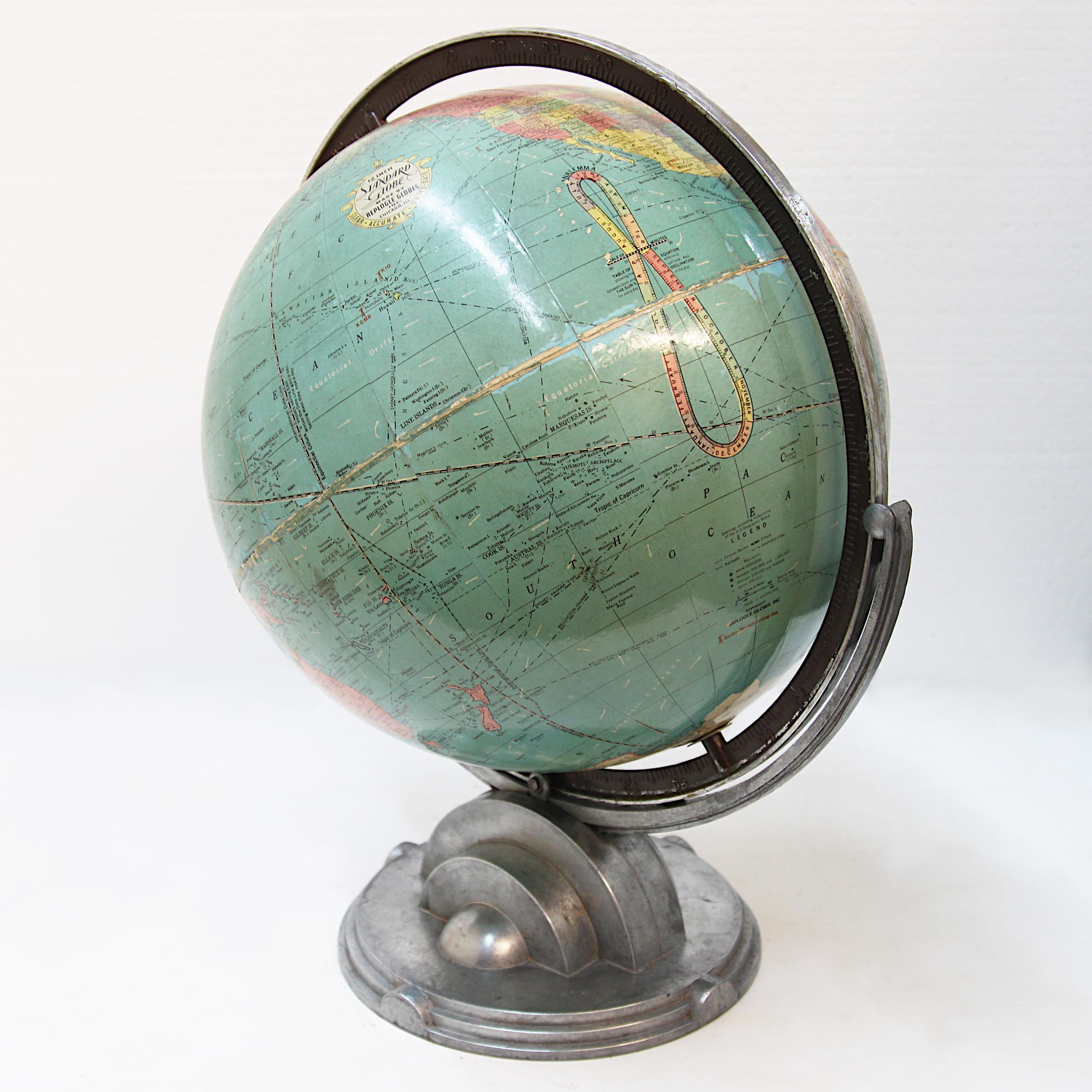 Wonderful Art Deco/ streamline Moderne desk globe by Replogle Globes Inc of Chicago, Illinois. Globe features 12