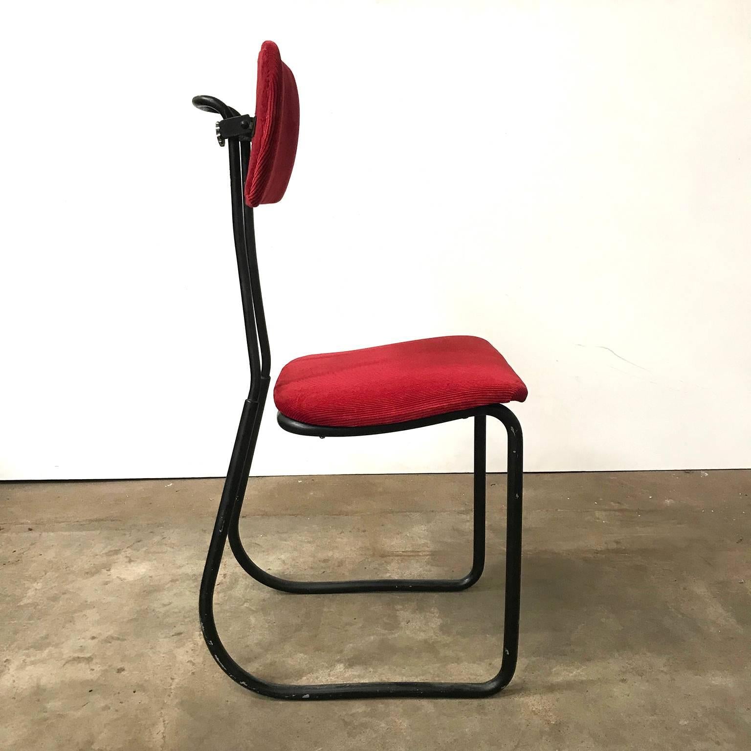 This typing chair in red Manchester upholstery has an elegant black base. The seat is not connected to the back. The backrest is adjustable in height as shown on picture #1 and #2. The upholstery is new and in excellent condition. The base shows