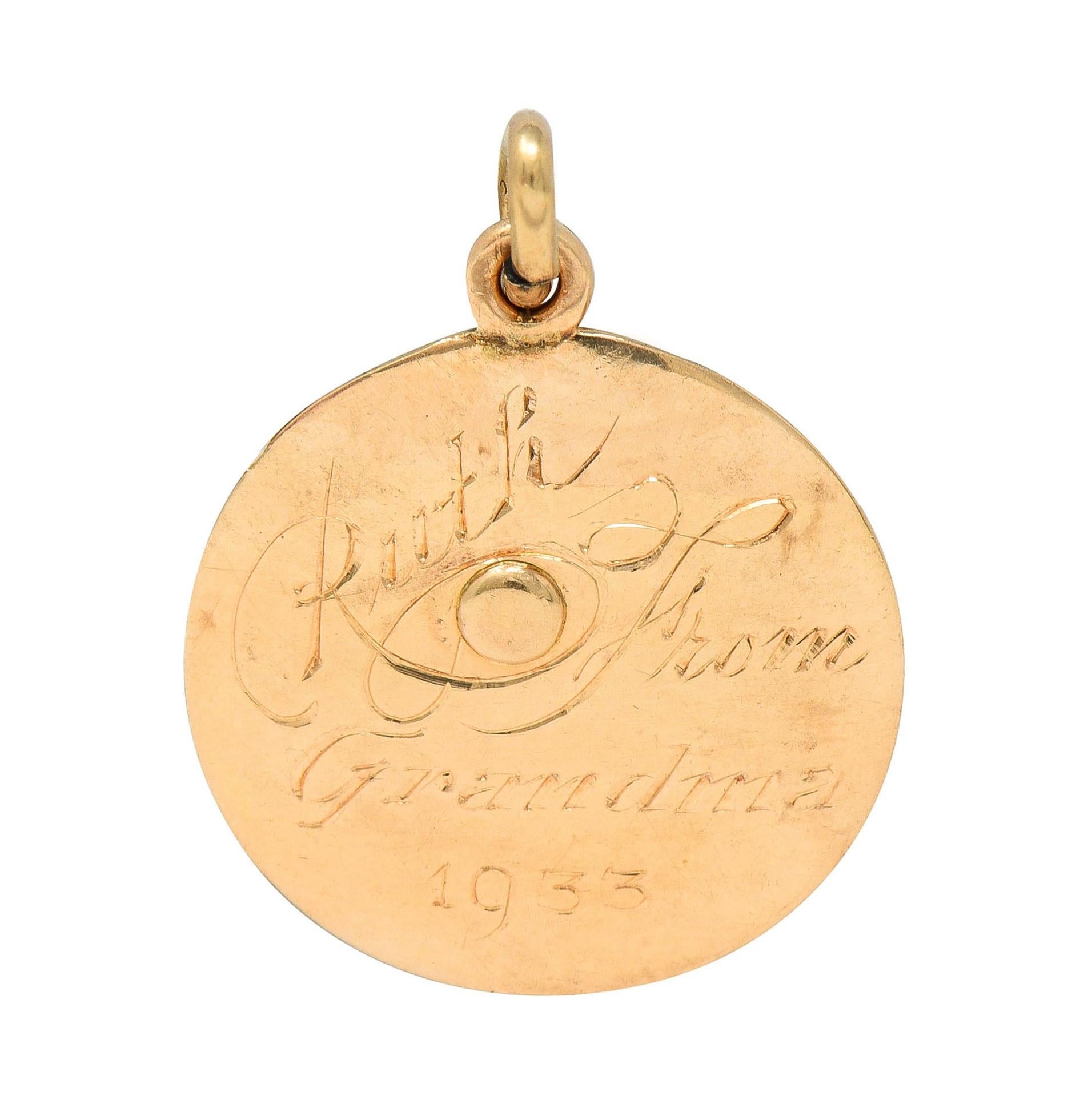 Designed as a round disk depicting a sunset over a harbor 
Rose gold with yellow gold ocean and platinum sunbeam
Depicting engraved buildings, mountains, and sun rays 
Accented by flush set rose cut diamond as sun
Weighing approximately 0.03 carat -