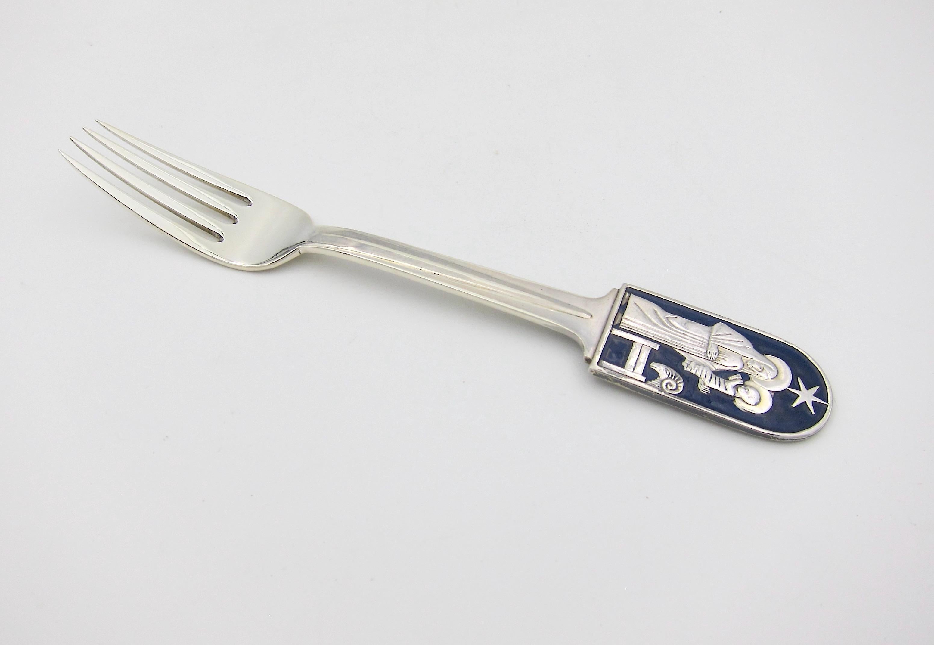 A Danish sterling silver and enamel Christmas fork from Anton Michelsen of Copenhagen, Denmark. This 