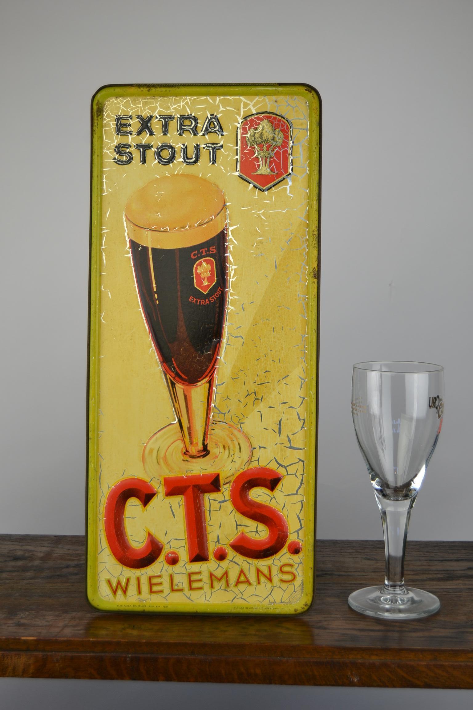 Antique tin sign for Belgian Beer of the brand Wielemans. 
This brewery was located in Brussels Belgium. 
The embossed metal sign was designed for the dark beer called Stout. 
Advertising sign was made in Brussels and dated 1934. 
It shows the