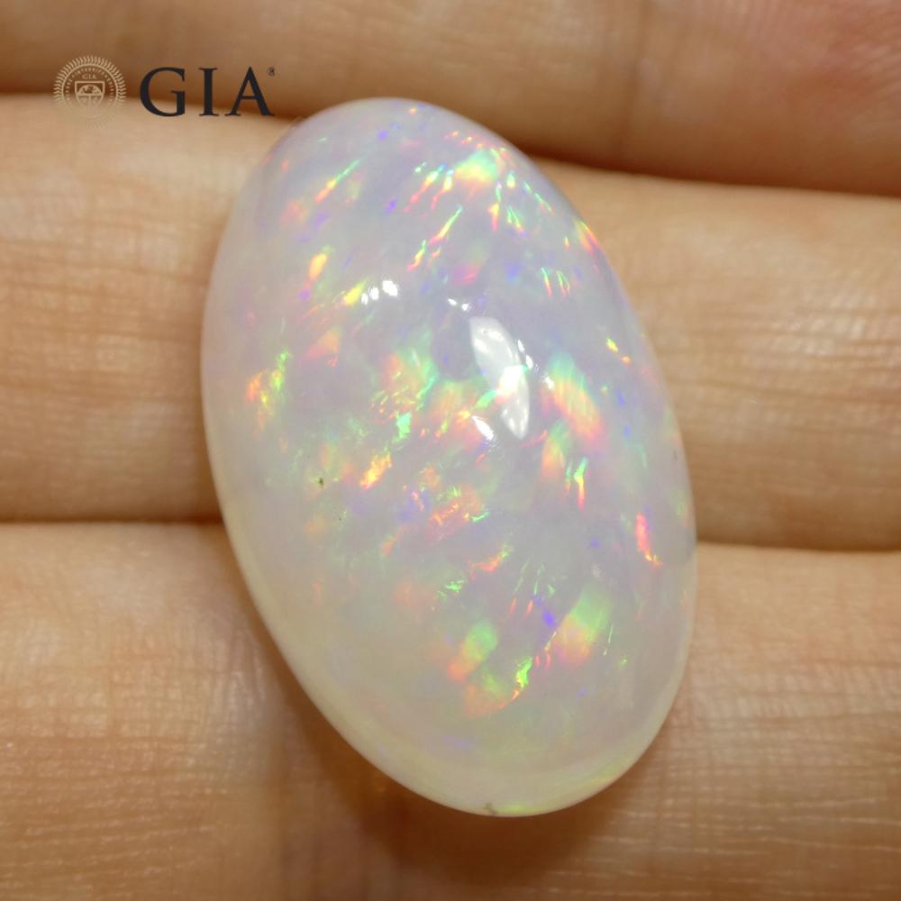 This is a stunning GIA Certified Opal 


The GIA report reads as follows:

GIA Report Number: 5231220307
Shape: Oval
Cutting Style: Double Cabochon
Cutting Style: Crown: 
Cutting Style: Pavilion: 
Transparency: Translucent
Colour: