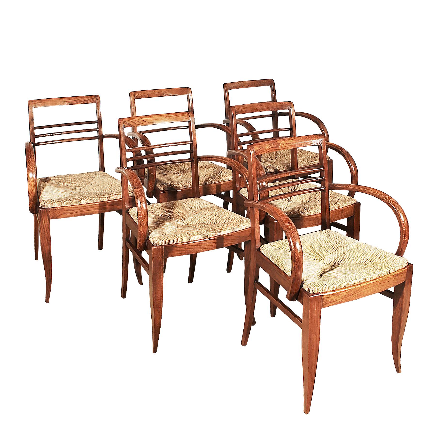 Set of six Art Deco small bridge armchairs, solid oakwood, French polish, original woven straw seat.
France, 1935-1940.