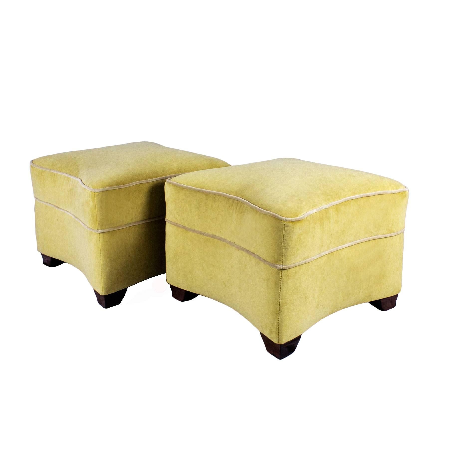 Outstanding pair of Art Deco ottomans, wood structure, new stuffing and light yellow velvet upholstery, done as in the originals. Four mahogany feet with signature and numbered, French polish. New fabric at the bottom with the originals furniture