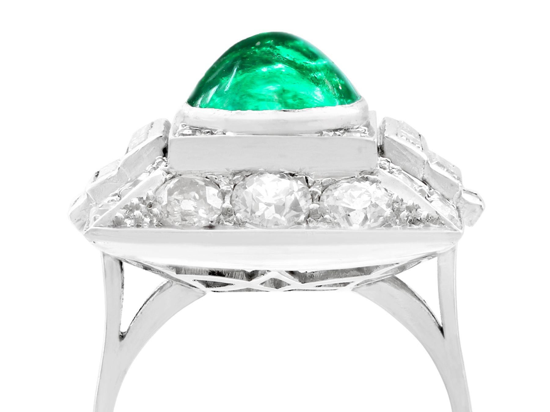 A stunning antique 3.40 carat Colombian emerald and 2.72 carat diamond, platinum cocktail ring; part of our diverse antique jewelry and estate jewelry collections.

This stunning, fine and impressive Colombian cabochon cut emerald cocktail ring has