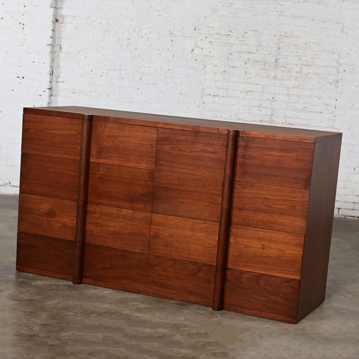 Magnificent Art Deco monumental dresser, sideboard, or chest of drawers comprised of solid walnut custom made & signed in 1935 styled after Donald Deskey, Paul Frankl, & Edward Wormley. Beautiful condition, keeping in mind that this is vintage and