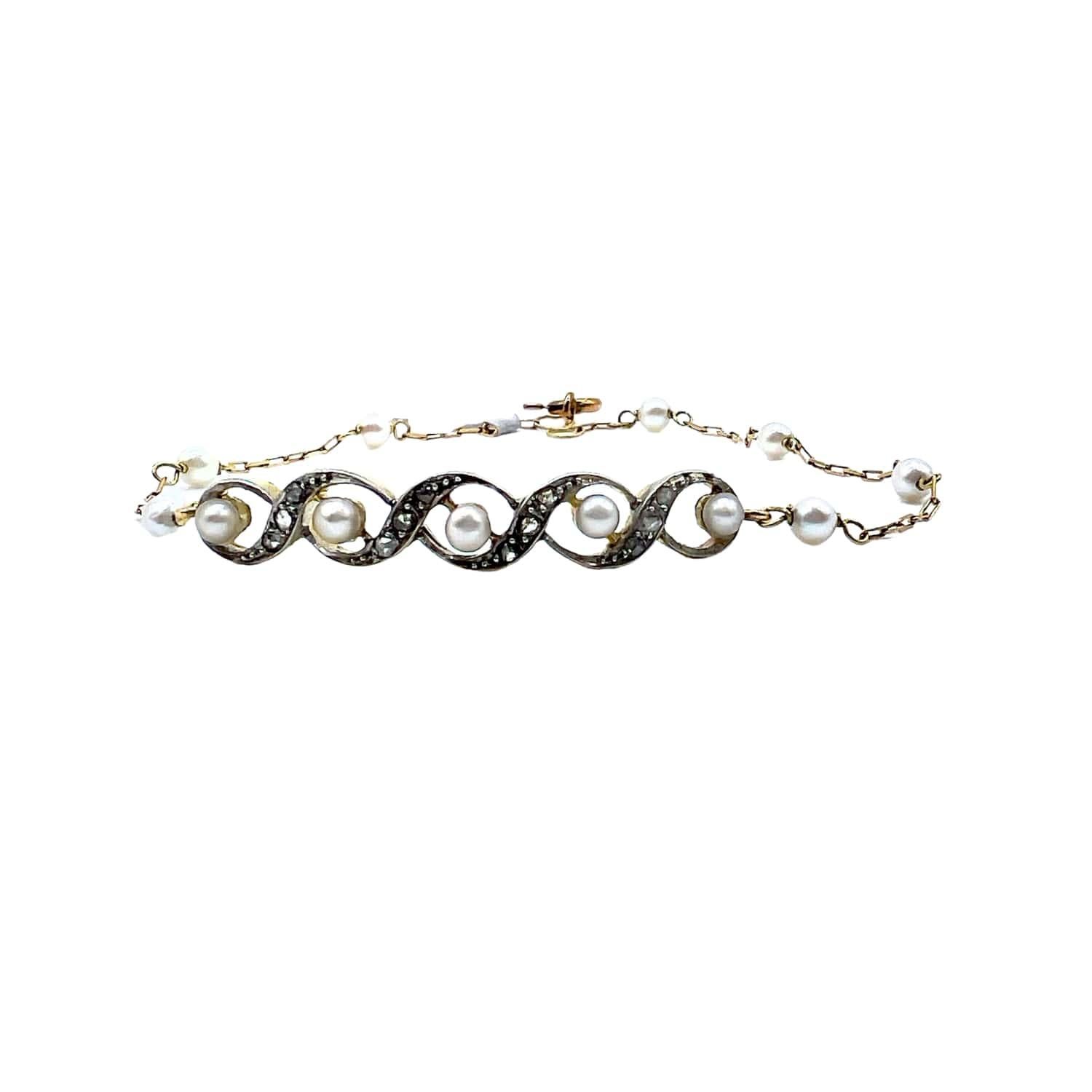 Elevate your ensemble with this exquisite bracelet boasting an Art Deco style from 1935. Crafted in 18k yellow gold and platinum 950 kts, it features a lustrous pearl and sparkling diamonds. The rose-cut or rough-cut diamonds total 0.12 carats with