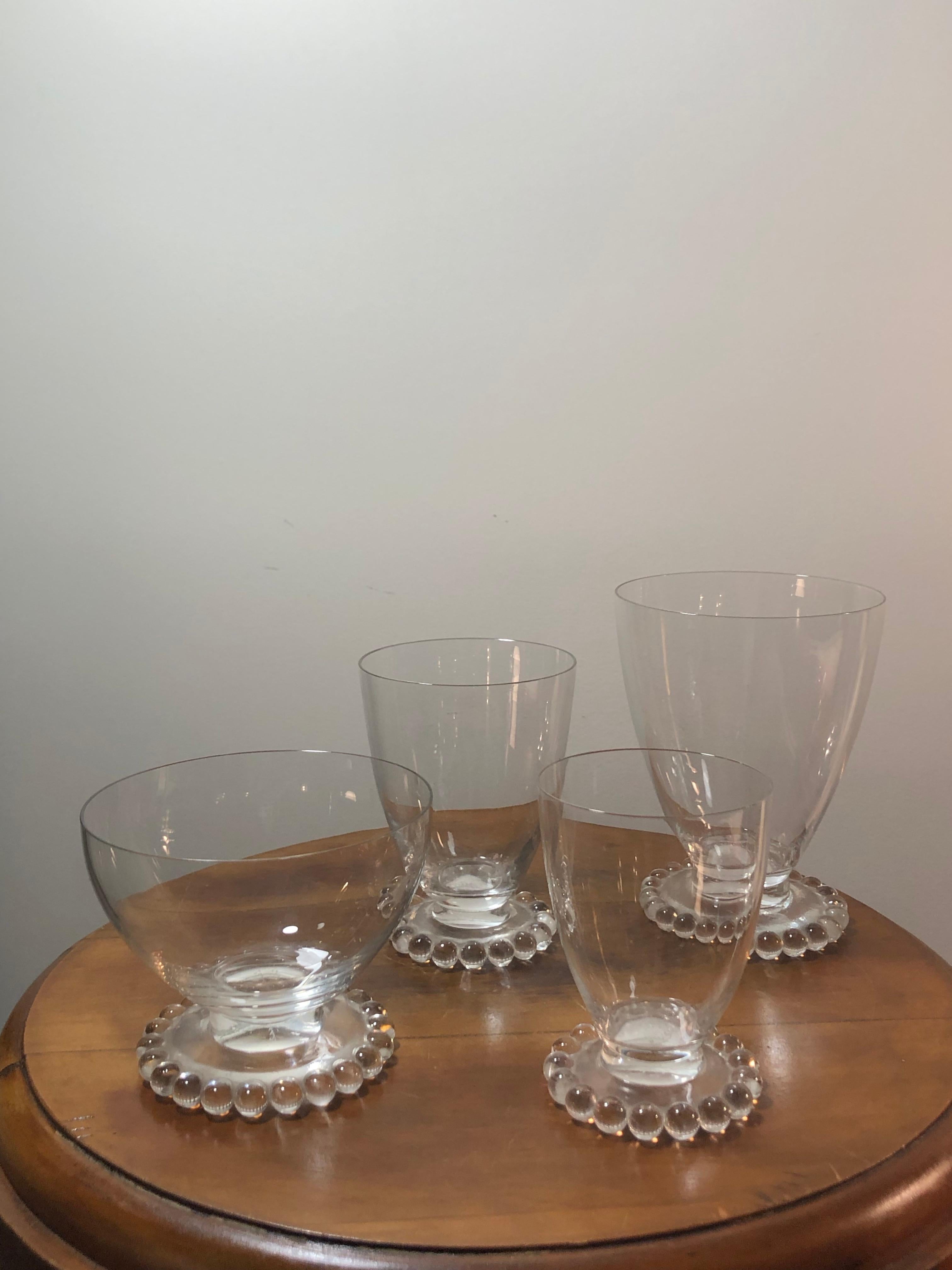 Set of 32 drinking glasses made by René Lalique in 1935. Model is nammed 