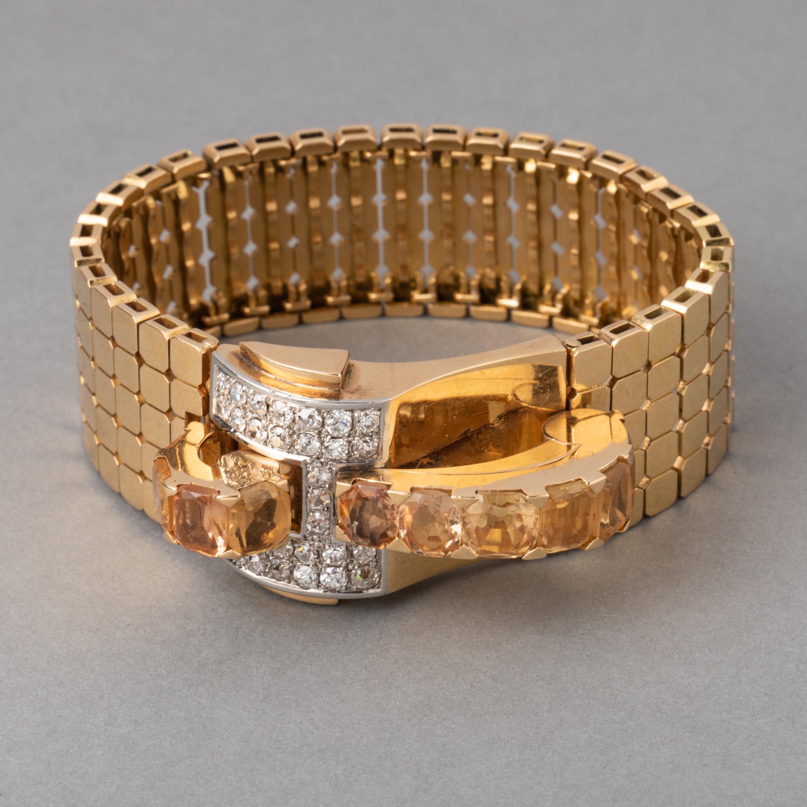 1935's Gold Diamonds and Citrines Bracelet

Very beautiful bracelet, made in France circa 1935/40. 
Gold 18k, 2.50 carats of diamonds. Set with citrines, the design is elegant.
Total weight is 79.10 grams.
The size is 17.5 cm, the bracelet is 2,1 cm