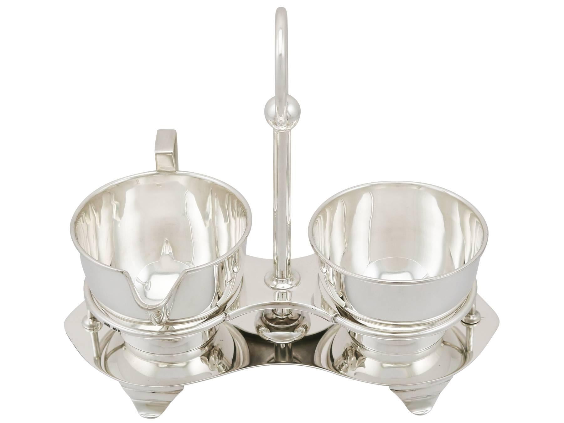 An exceptional, fine and impressive antique Edward VIII English sterling silver cream and sugar set; an addition to our antique teaware collection

This exceptional antique Victorian sterling silver cream and sugar compendium consists of a cream