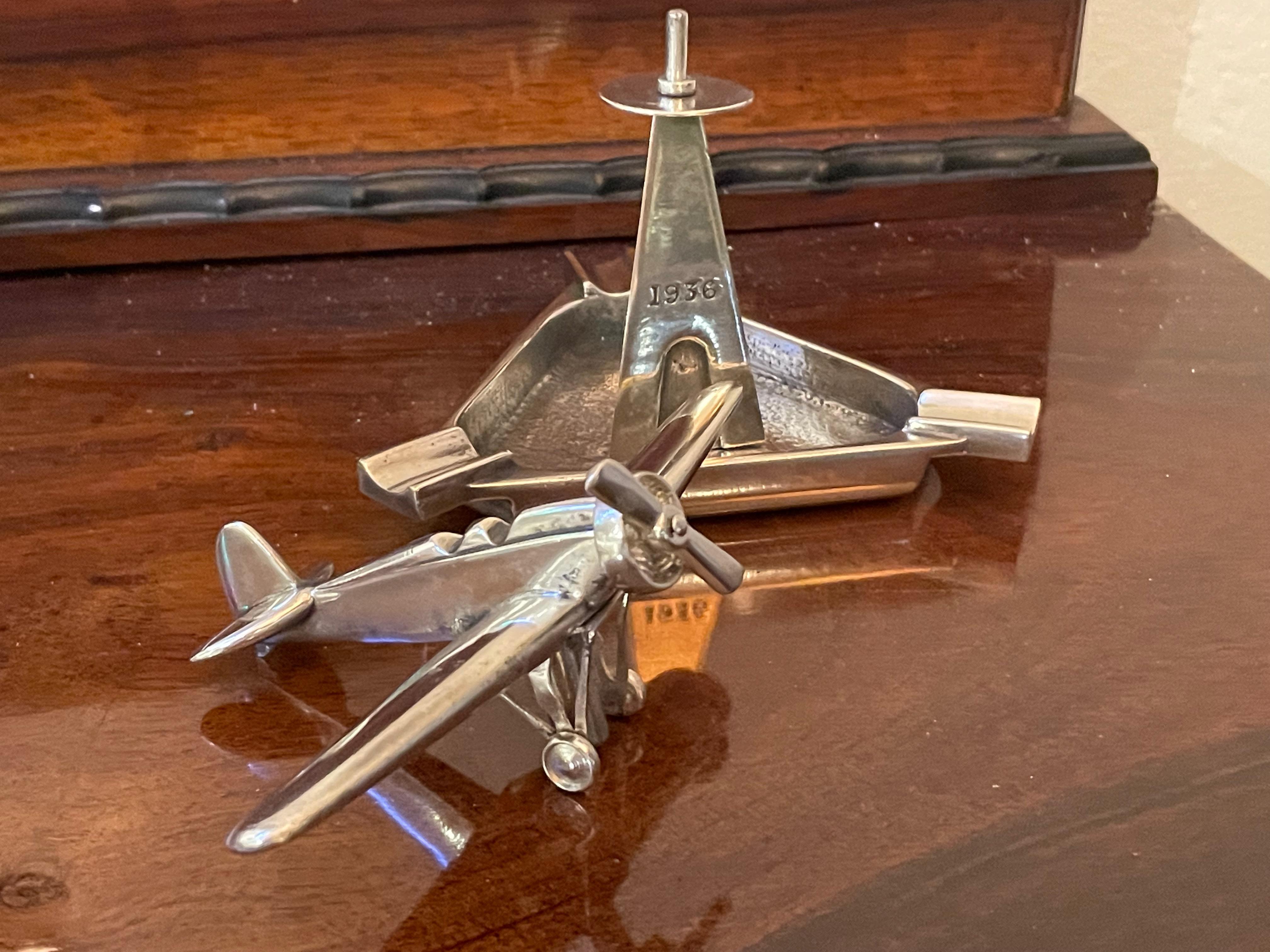1936 Art Deco Trophy Propeller Airplane ash tray. Purchased in Argentina, seems to be from an event on June 25th, 1936 as indicated on the support base for the plane. Great condition, the propeller moves freely, and is a wonderful statue that